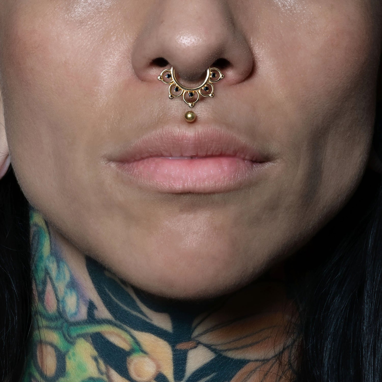 model wearing 14k Gold Open Lotus Septum Clicker
