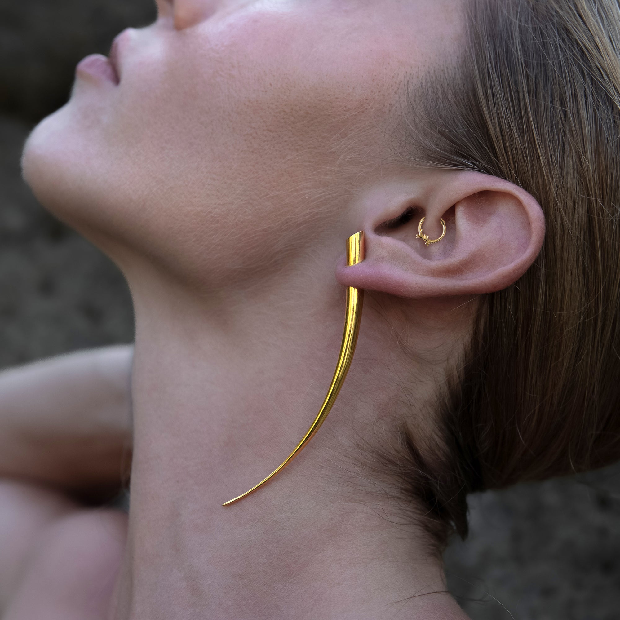 model wearing 14k Gold Twig Clicker ring on her daith