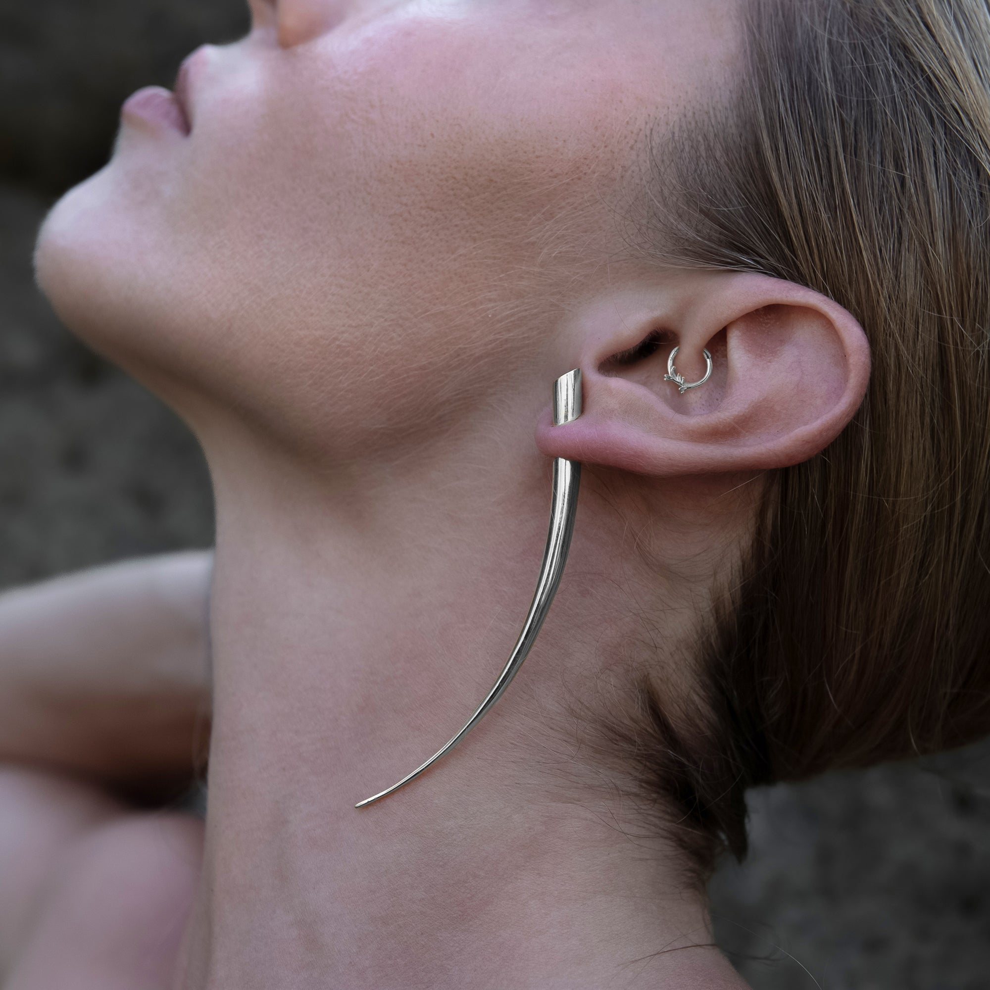 model wearing 14k White Gold Twig Clicker ring on her daith