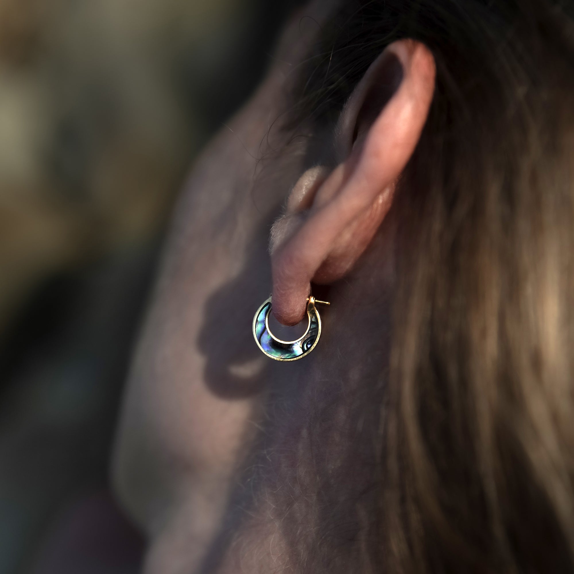 model wearing Golden Aanya Abalone small huggies Earrings