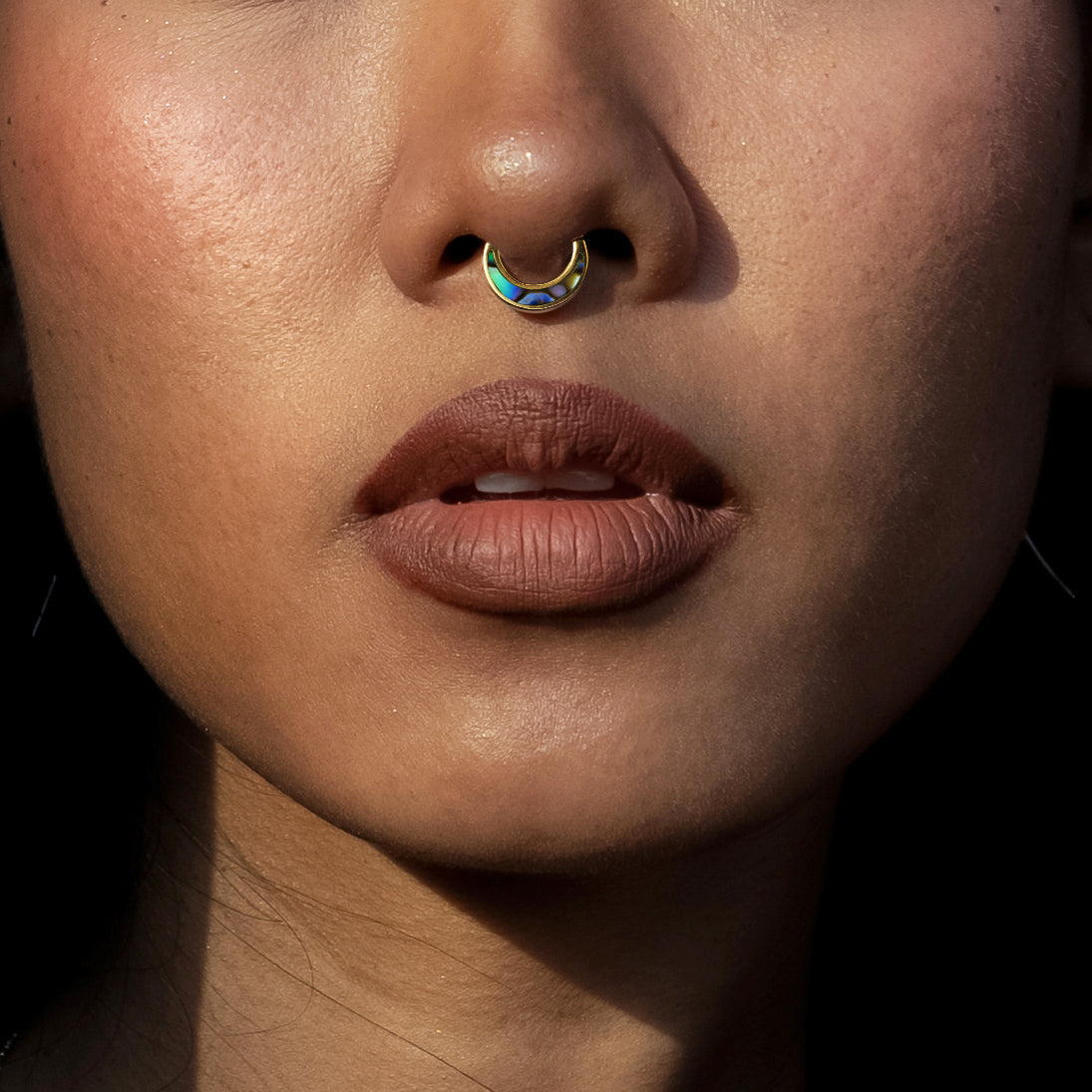 model wearing Aanya Abalone Septum
