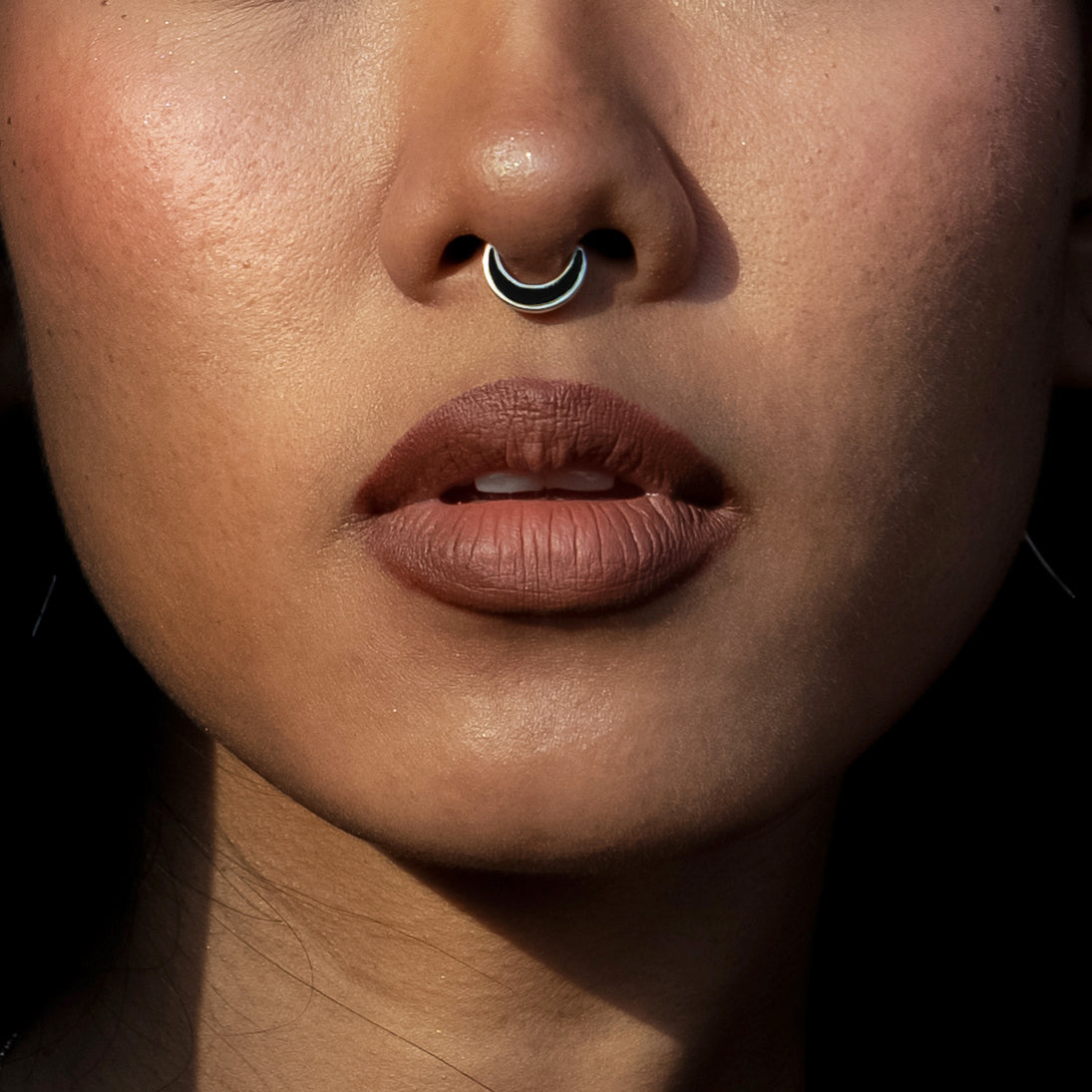 model wearing Aanya Black Shell Silver Septum