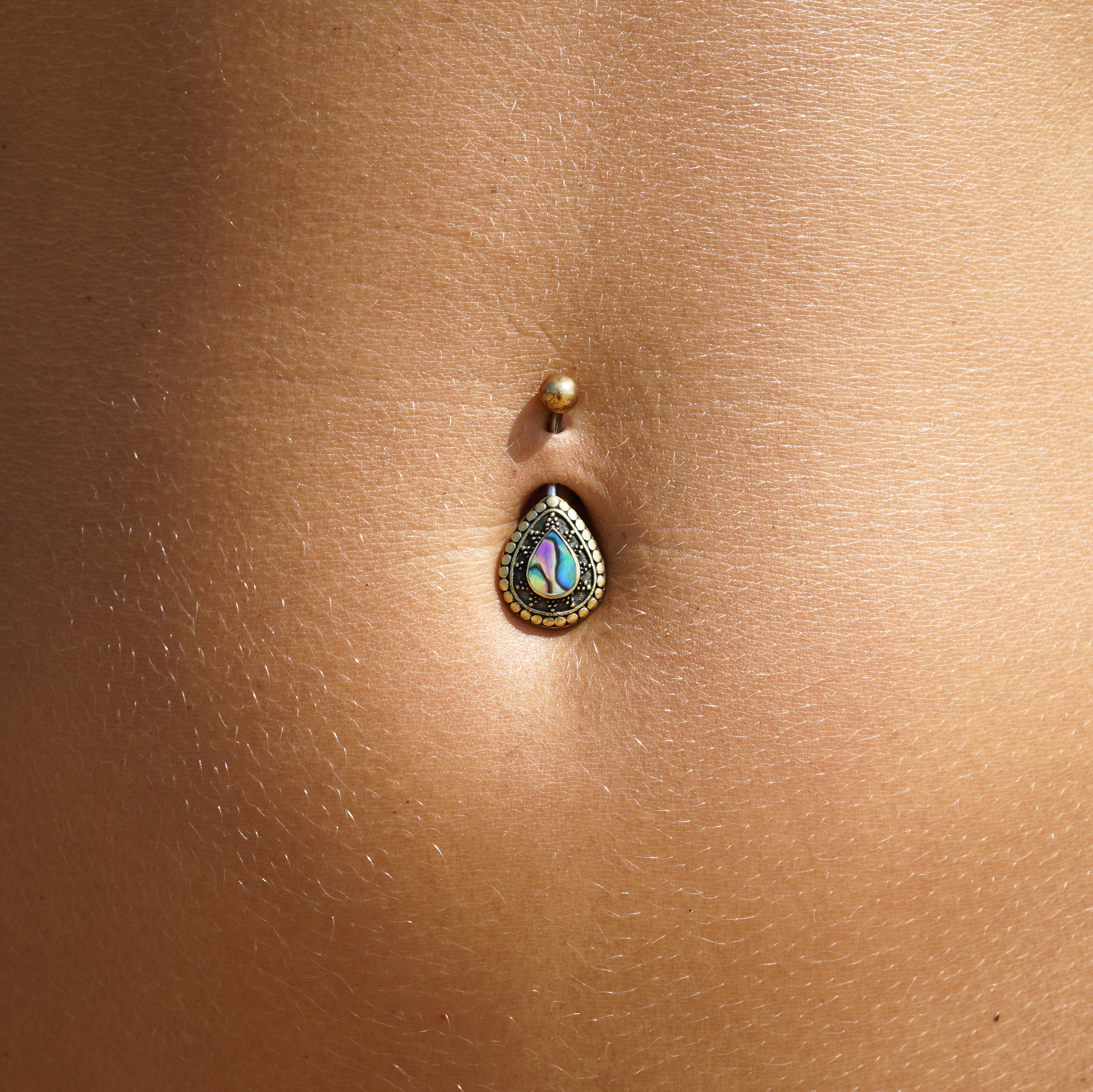 model wearing Adira Abalone Belly Bar