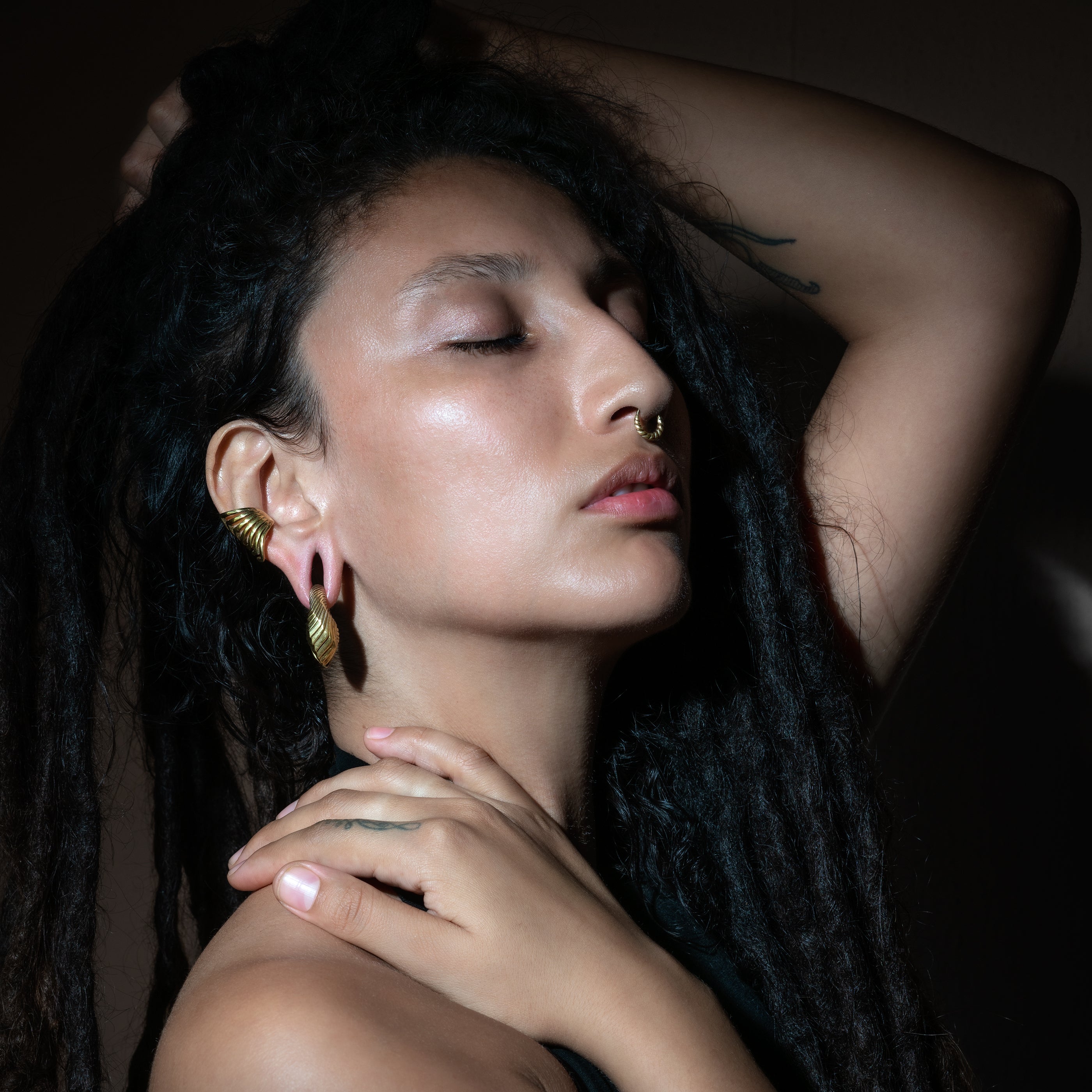 model wearing Golden Amari Ear Weights Hangers