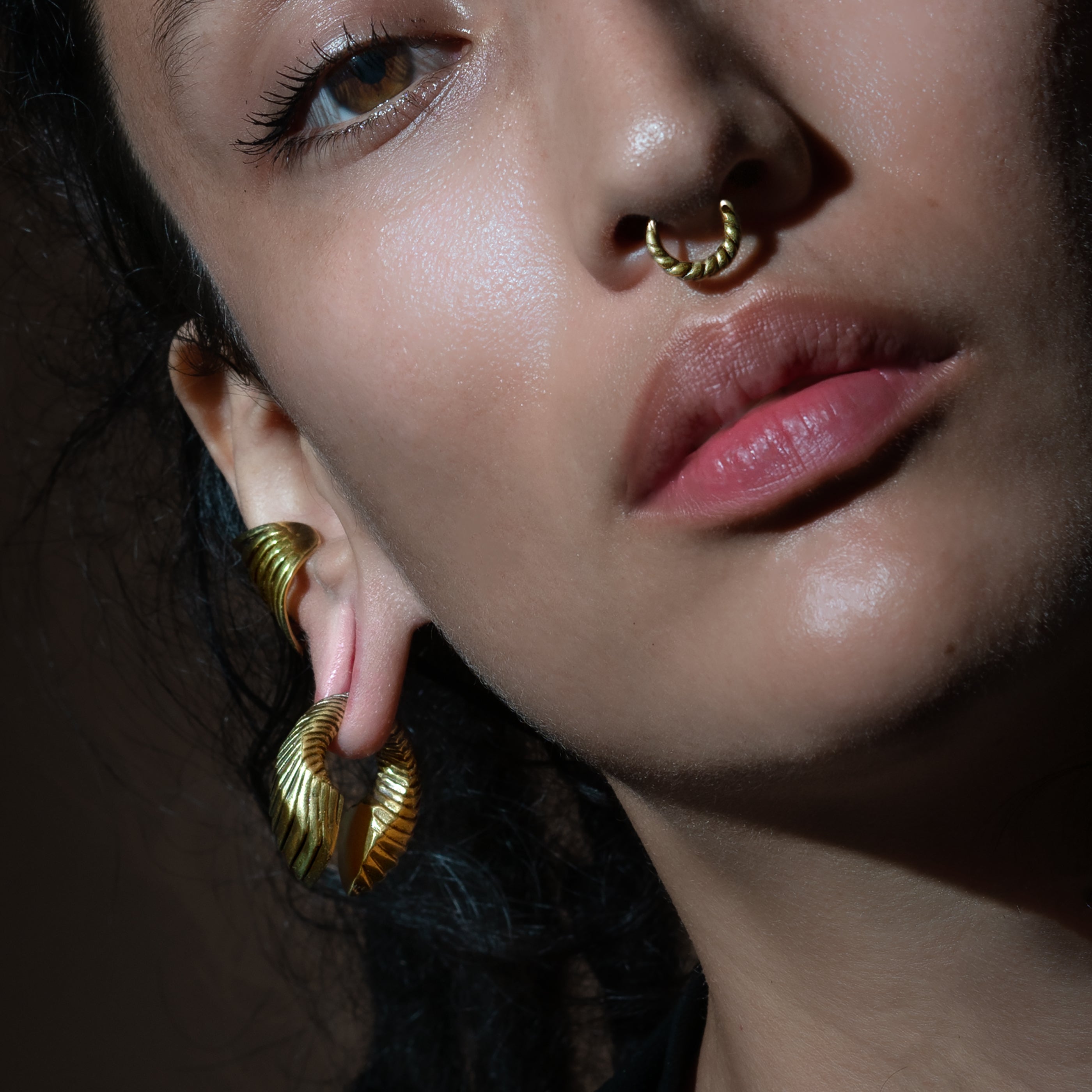 model wearing Golden Amari Ear Weights Hangers