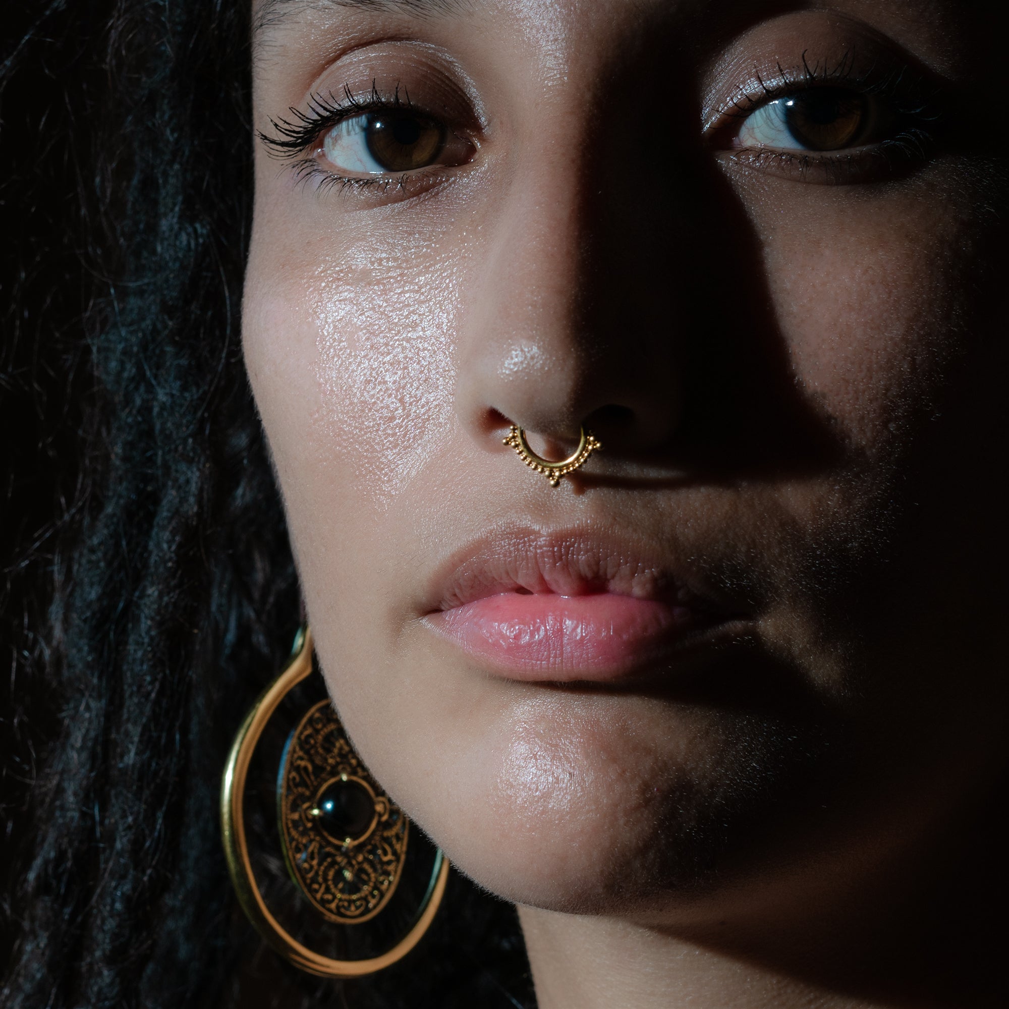 model wearing Golden Deva Septum Clicker Ring