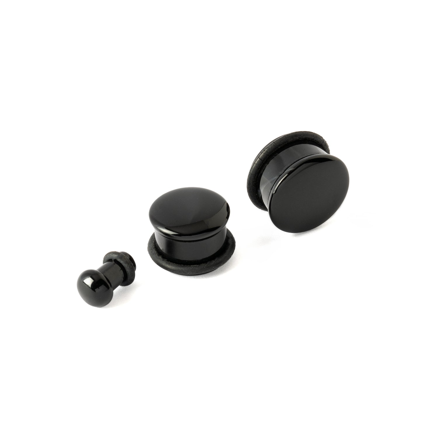 3 different sizes of Single Flare Black Agate Plugs