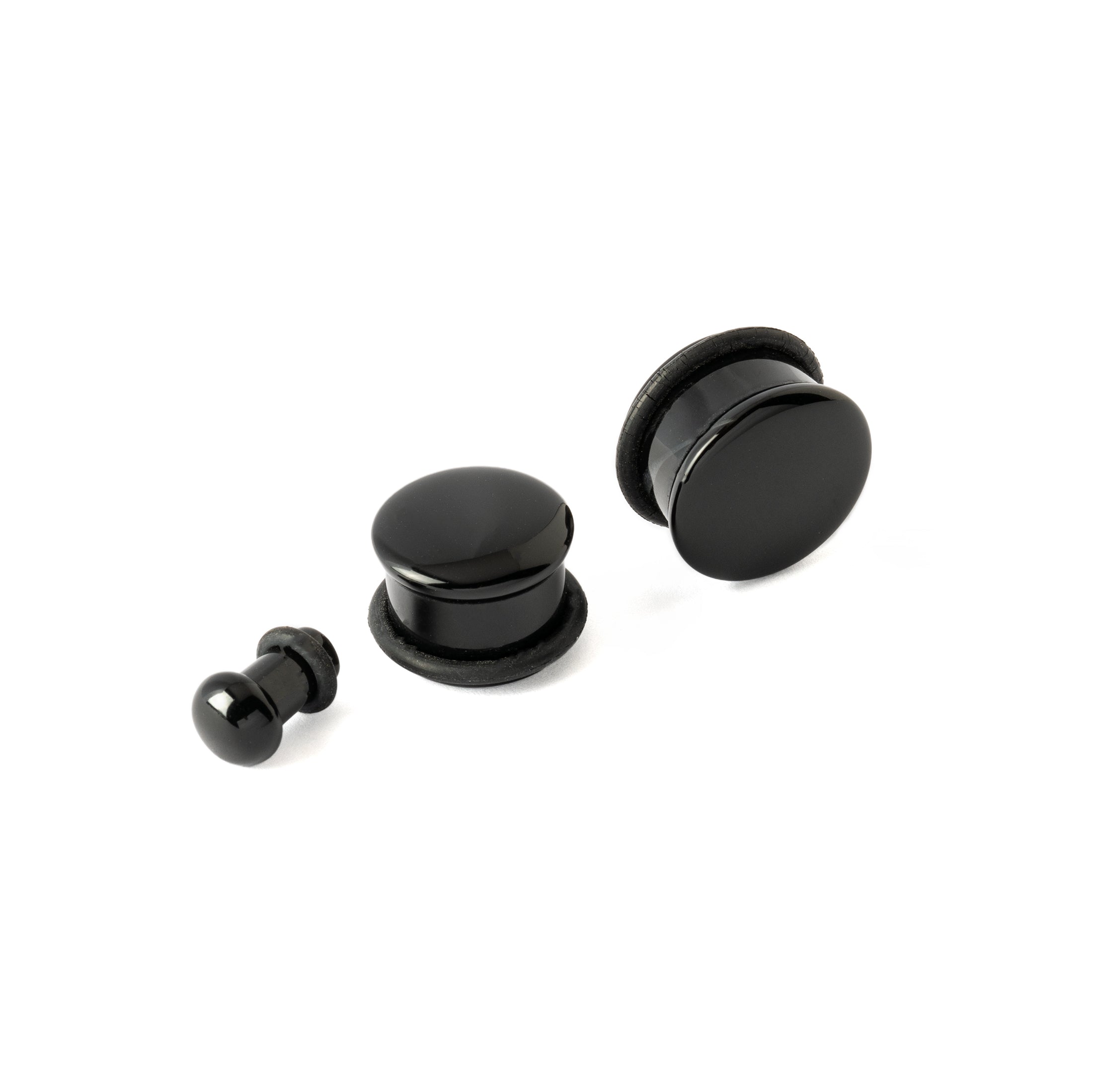 3 different sizes of Single Flare Black Agate Plugs