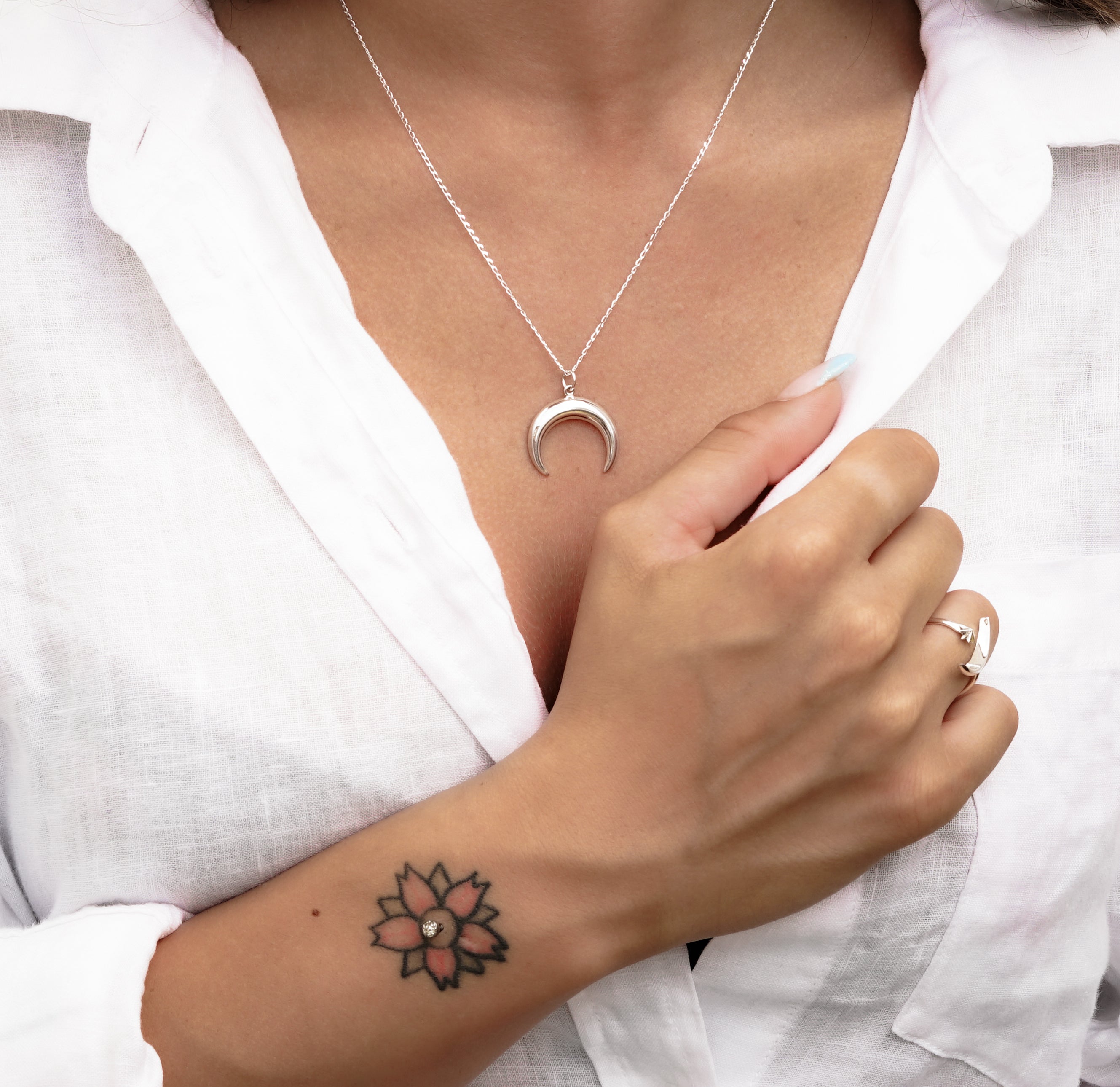 model wearing Silver crescent moon charm on a chain necklace