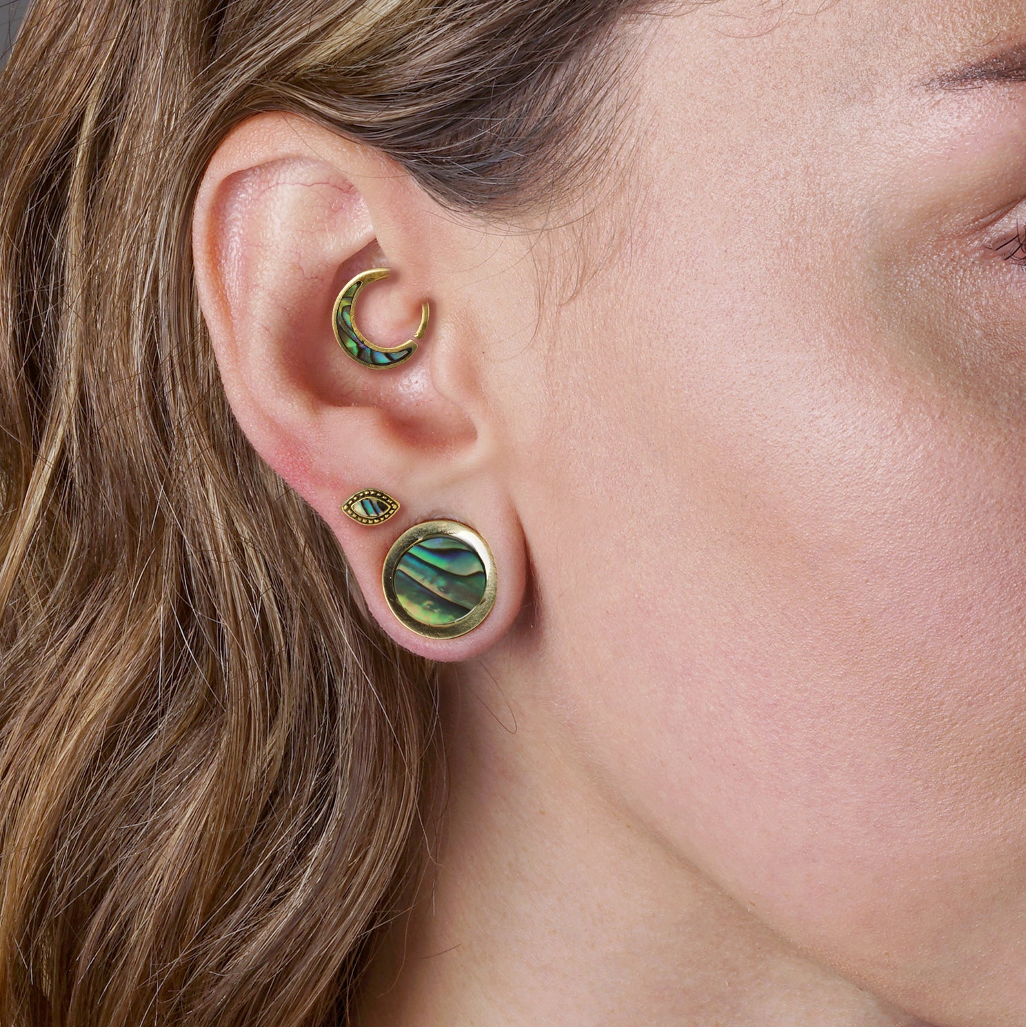 model wearing Golden Agatha Labret with Abalone