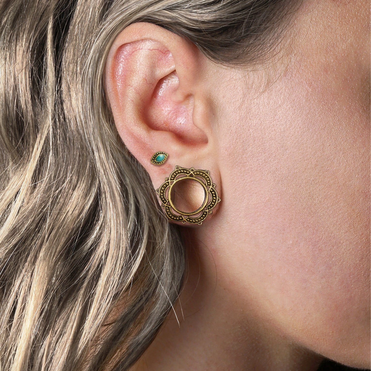model wearing Golden Lalita Mandala Tunnels and Golden Agatha Labret with Turquoise on her upper lobe