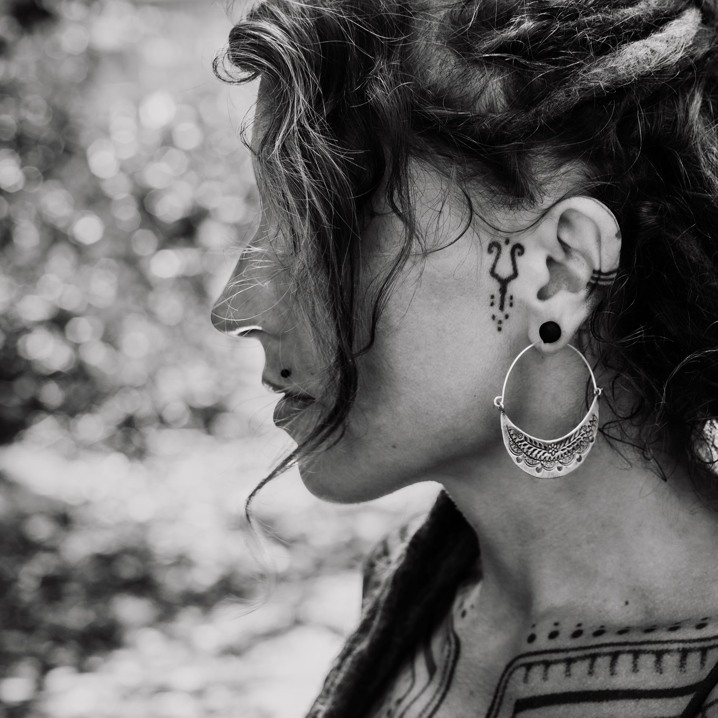 model wearing Half Moon Tribal Silver Earrings