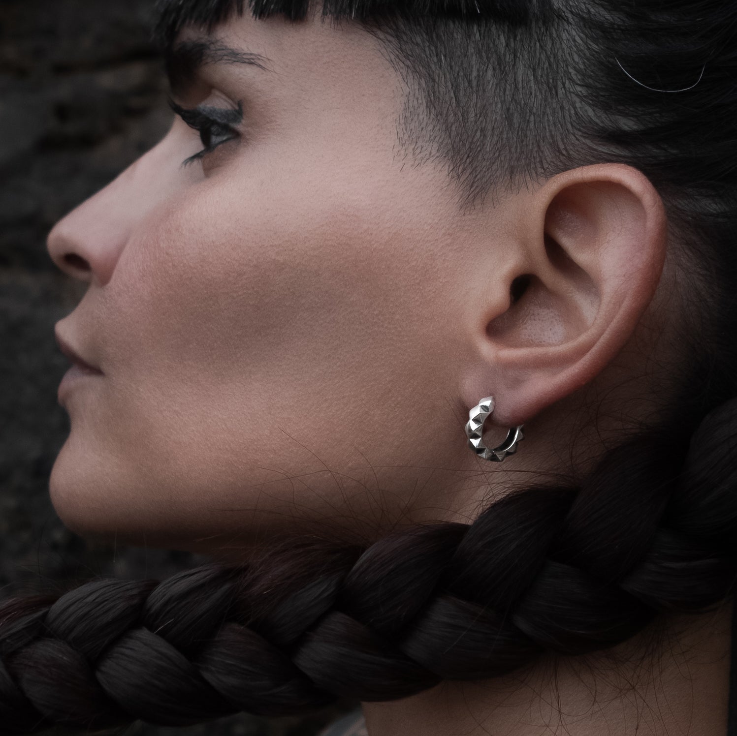 model wearing Silver Rhombus Huggie Hoops earrings