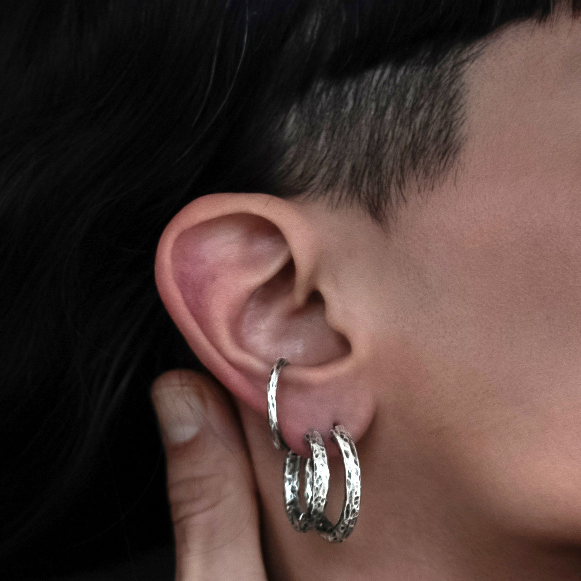 model wearing 26mm and 22mm Hammered Silver Clicker Hoops earrings