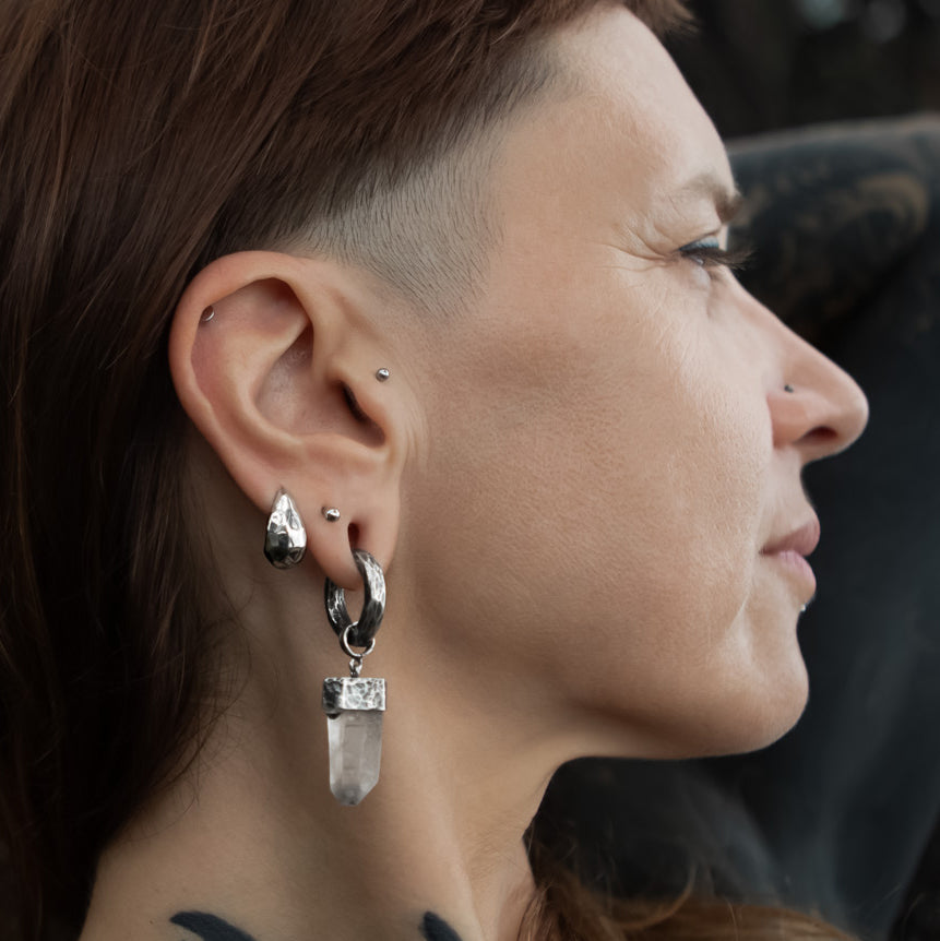 model wearing Hammered Silver Teardrop Huggies