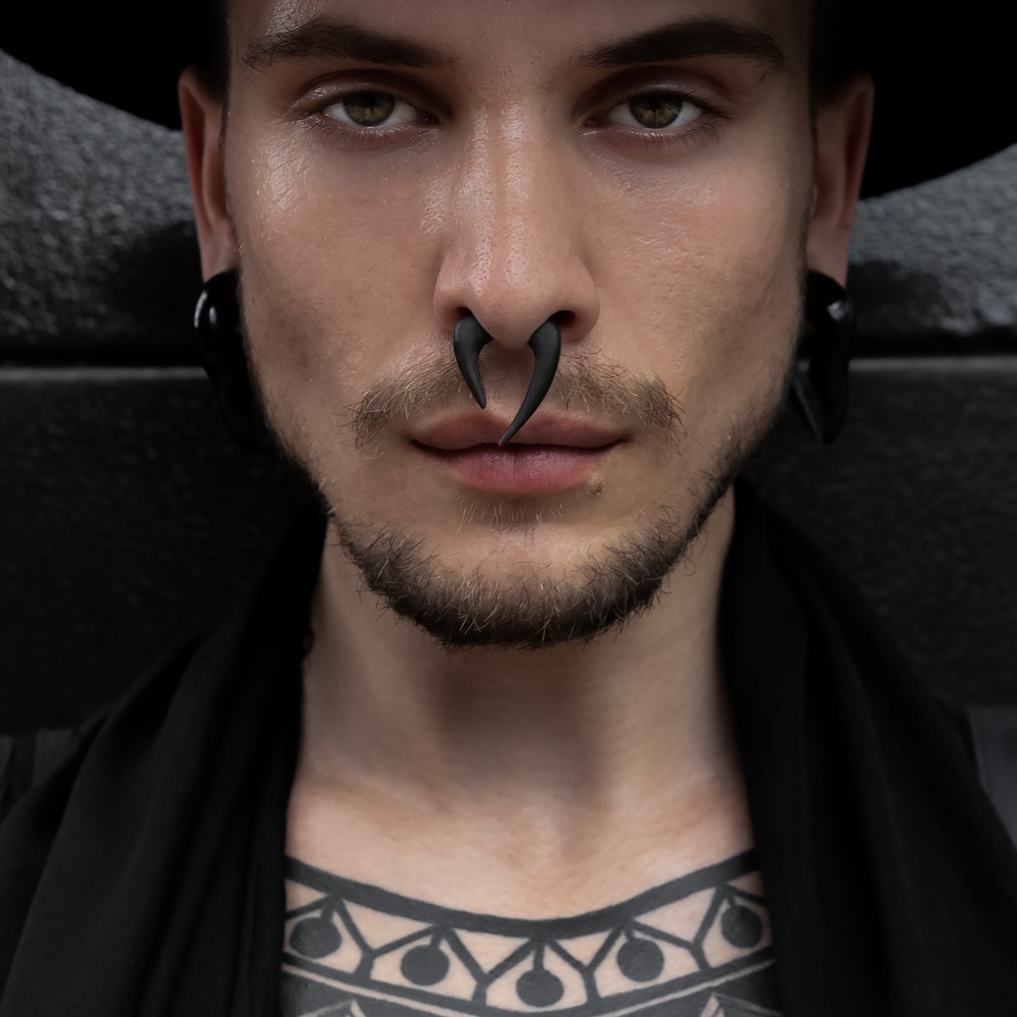 men wears Bermuda Triangle Taper as a septum