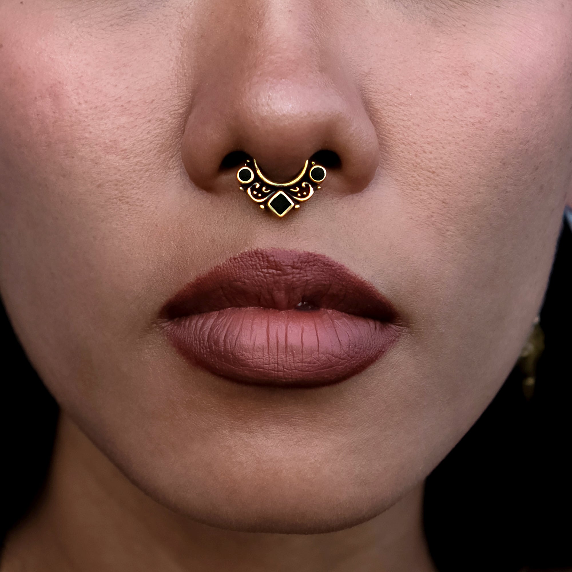 model wearing Agatha Black Shell Septum