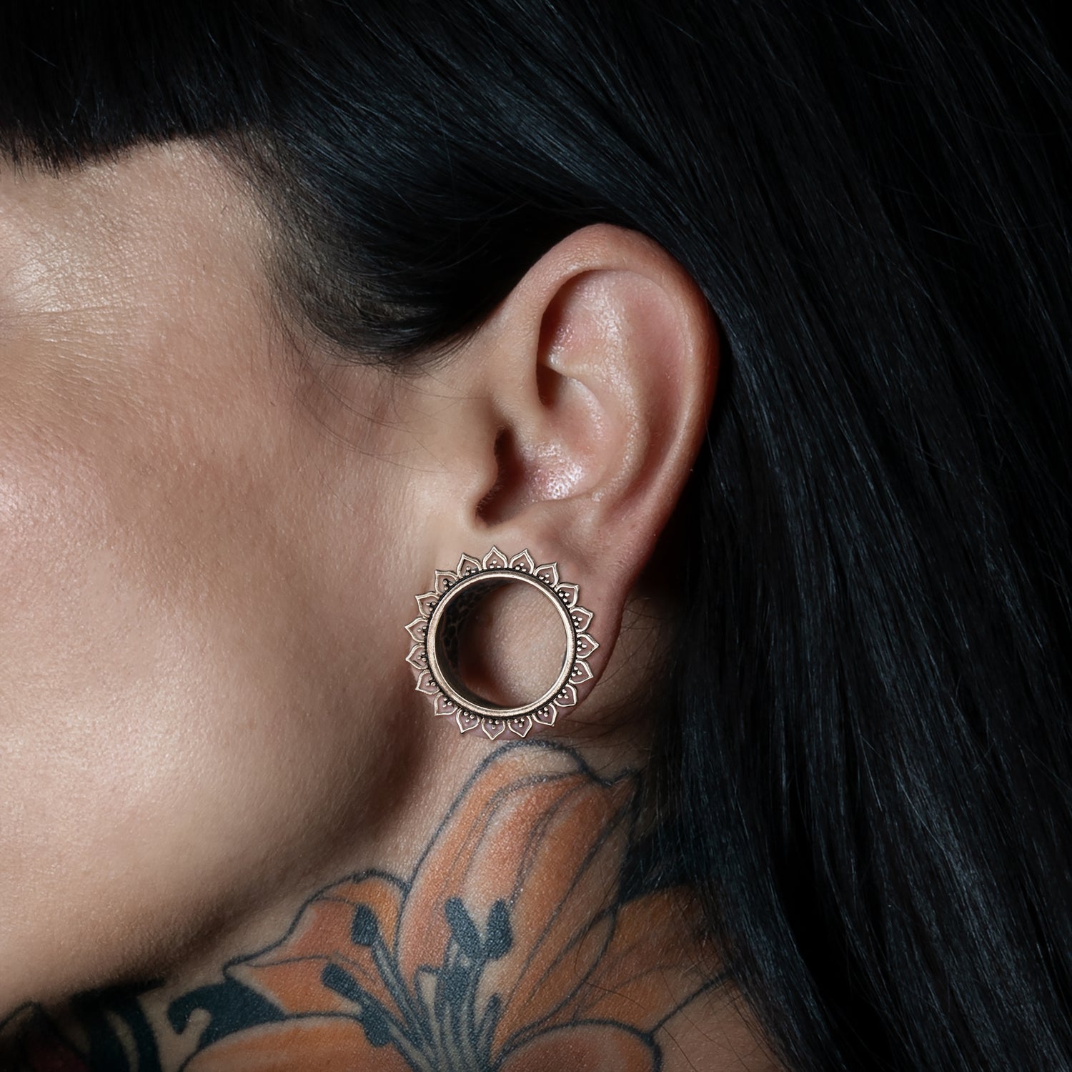 model wearing Iriya Lotus Petals Silver Tunnels