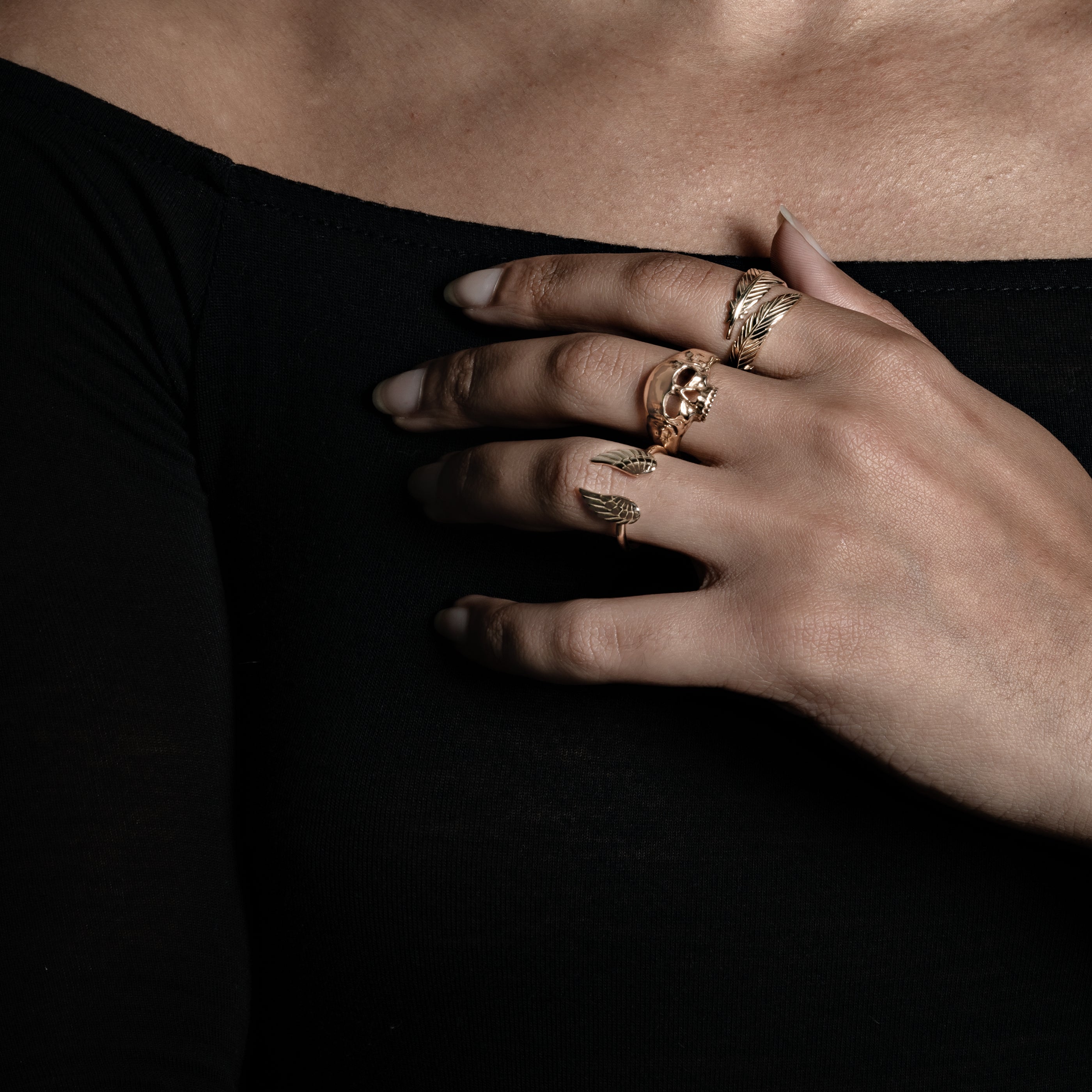 model wearing Immortal Ring, feather ring and wing ring