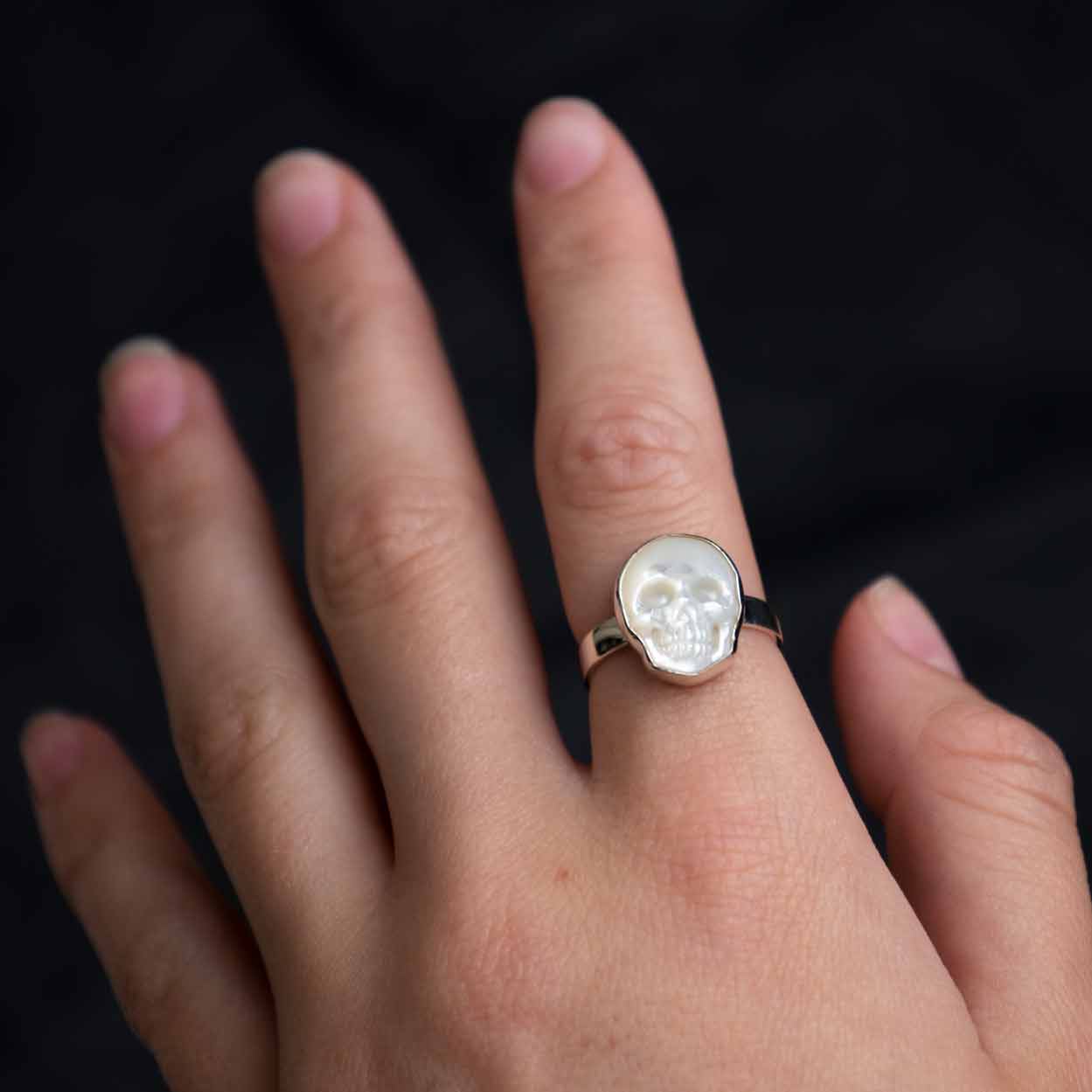 model wearing Mother Of Pearl Skull Ring 