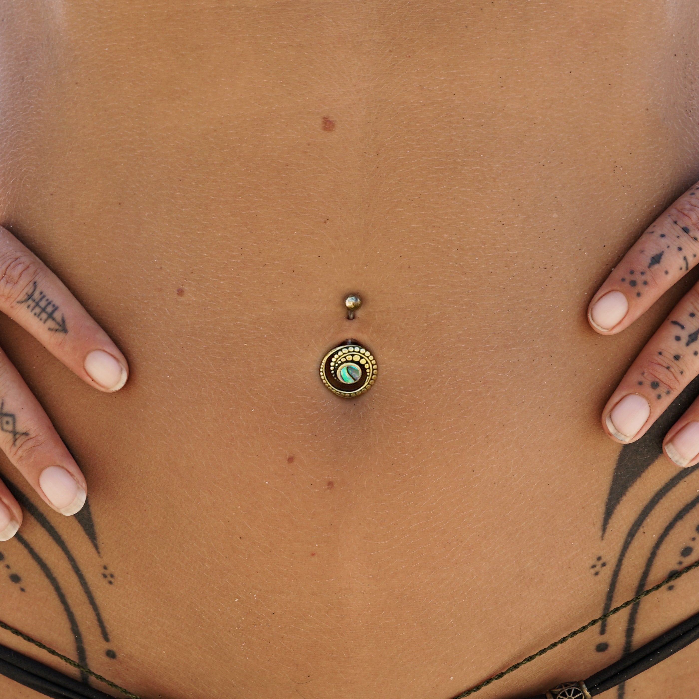 model wearing Spiral Abalone Belly Bar