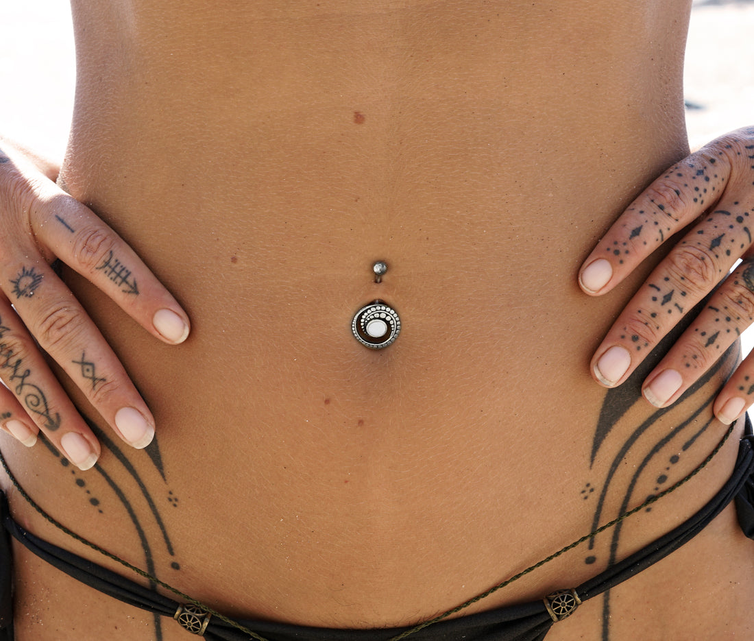 model wearing Spiral Crop Mother of Pearl Belly Bar