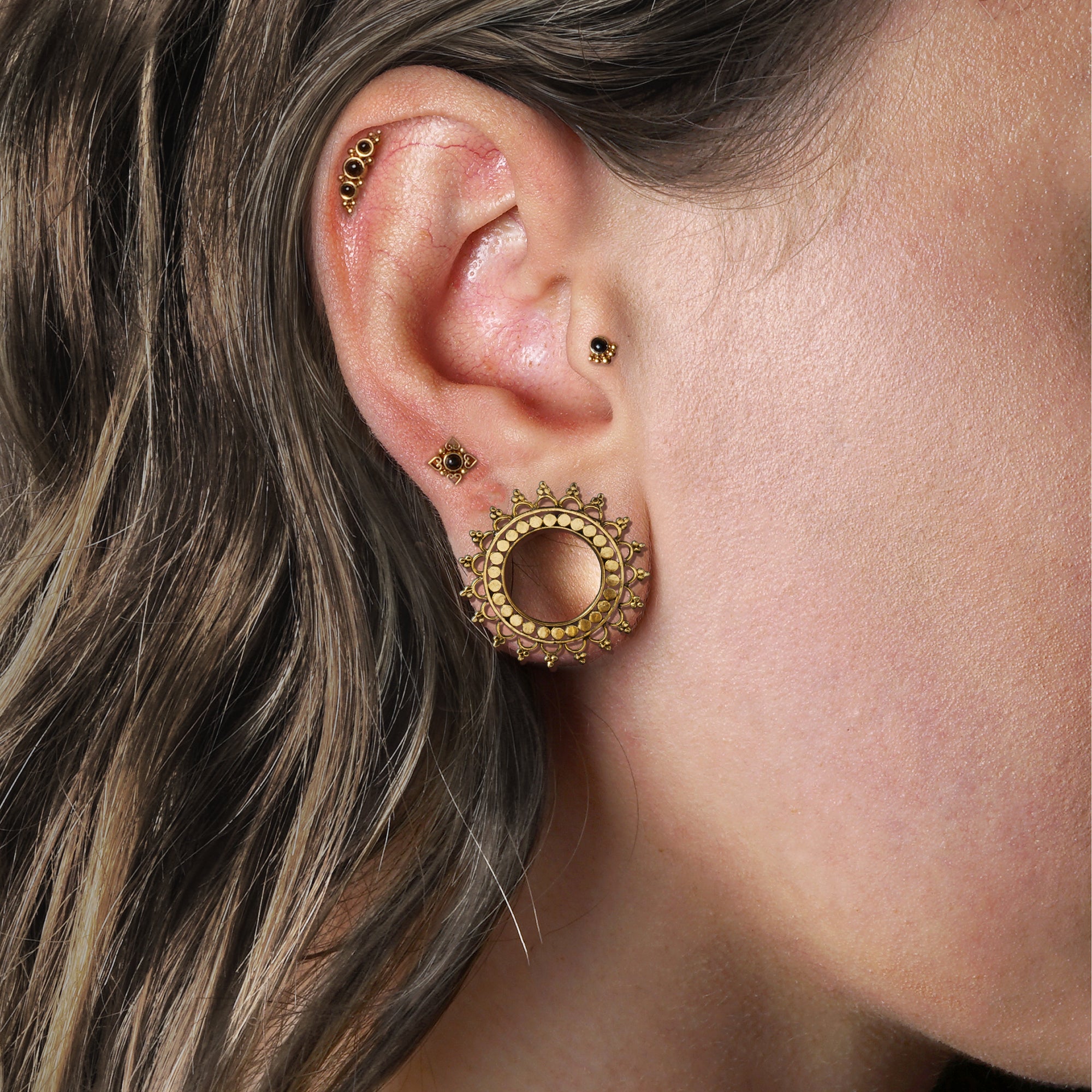 model wearing Layla Golden Labret with Onyx on her tragus