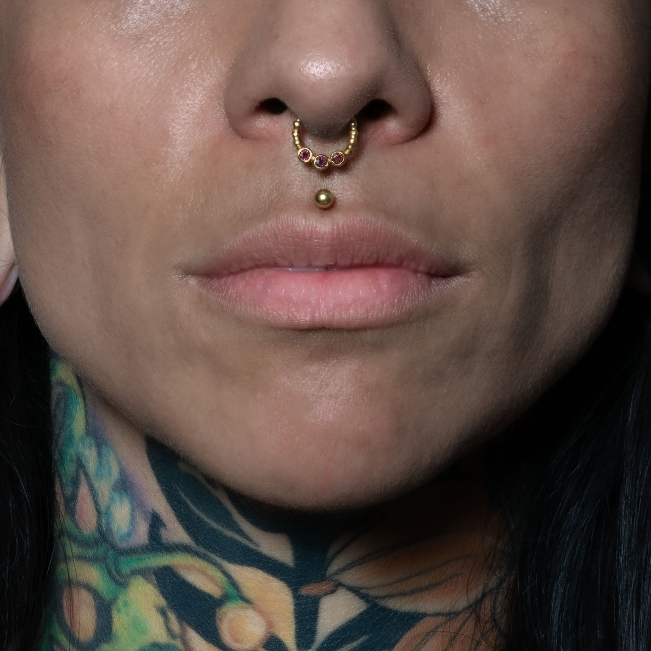 model wearing Trio Garnet Gold Septum