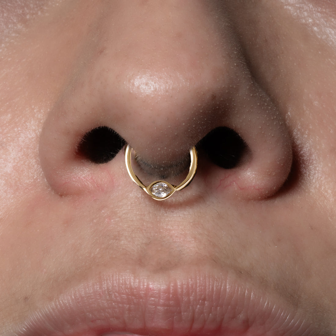 model wearing Zirconia Eye Clicker Ring on her setum