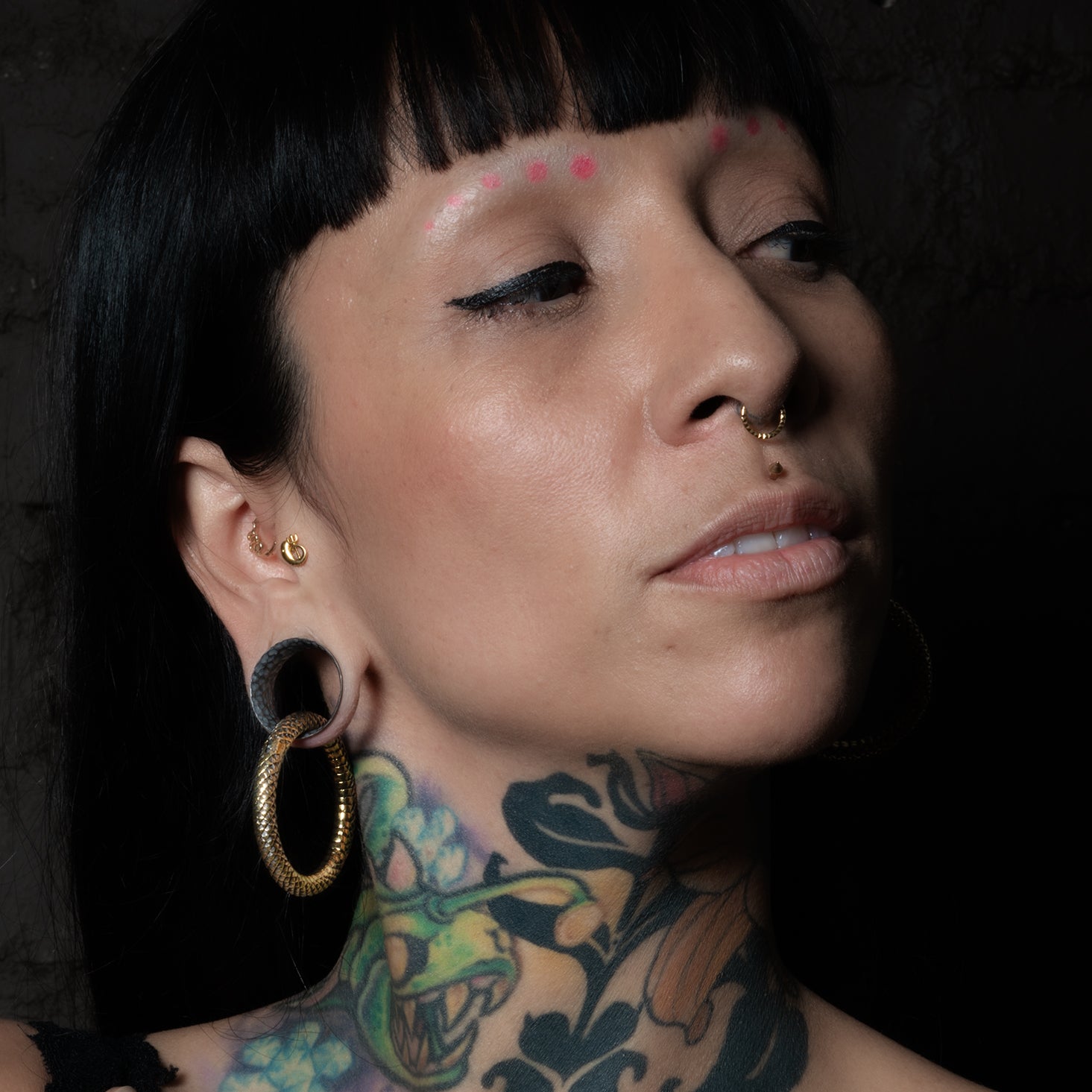 model wearing Hammered Black Silver Tunnel with rebirth oops