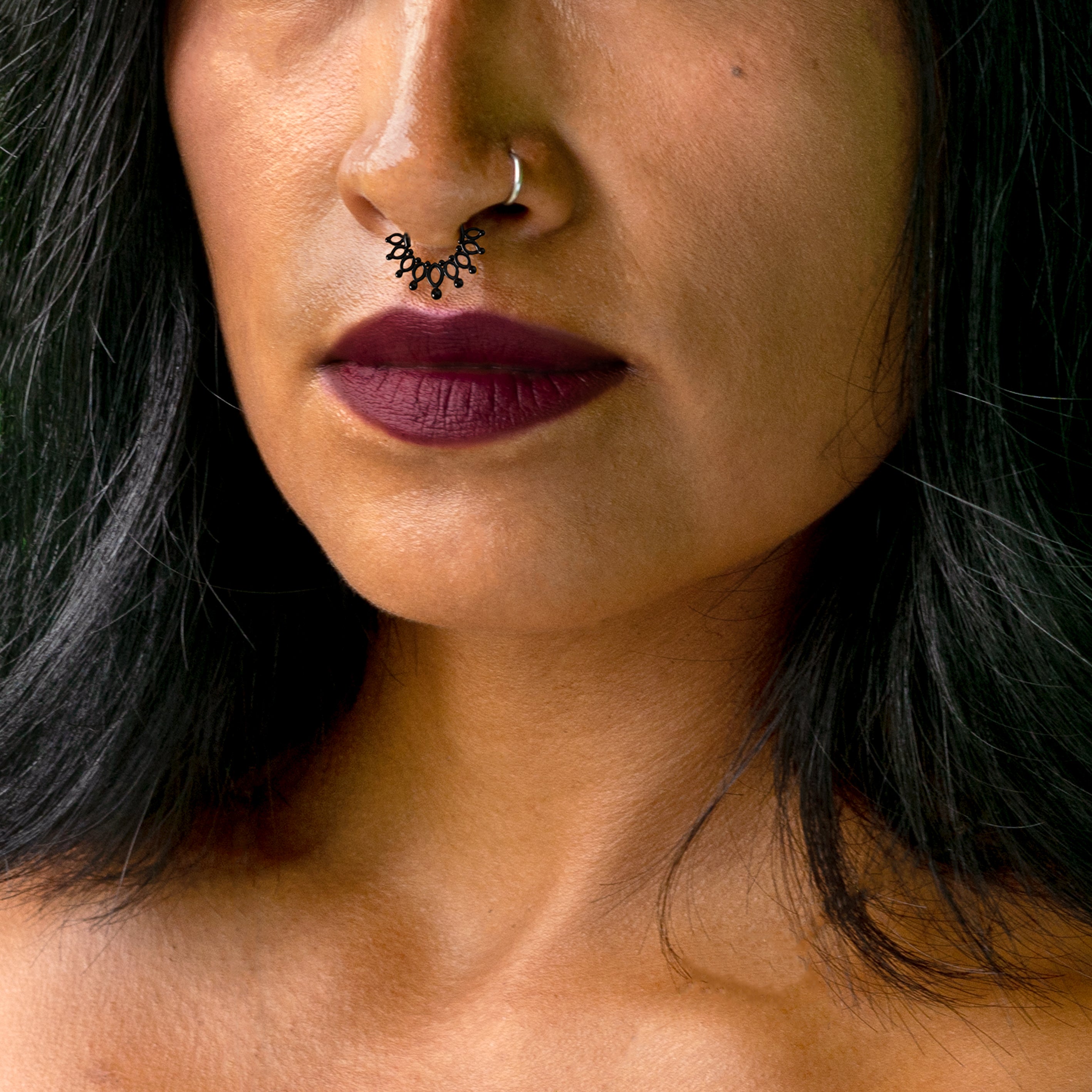 model wearing Anastasia Black Septum Clicker