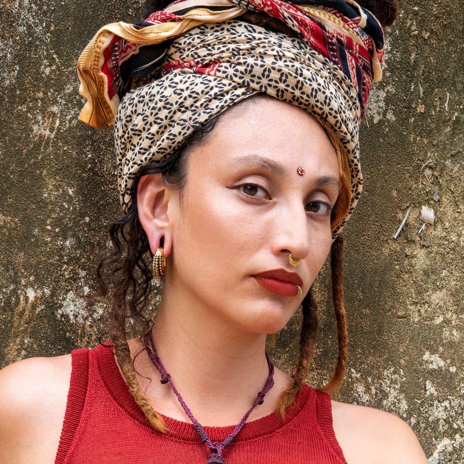 model wearing Gold Meena septum clicker ring