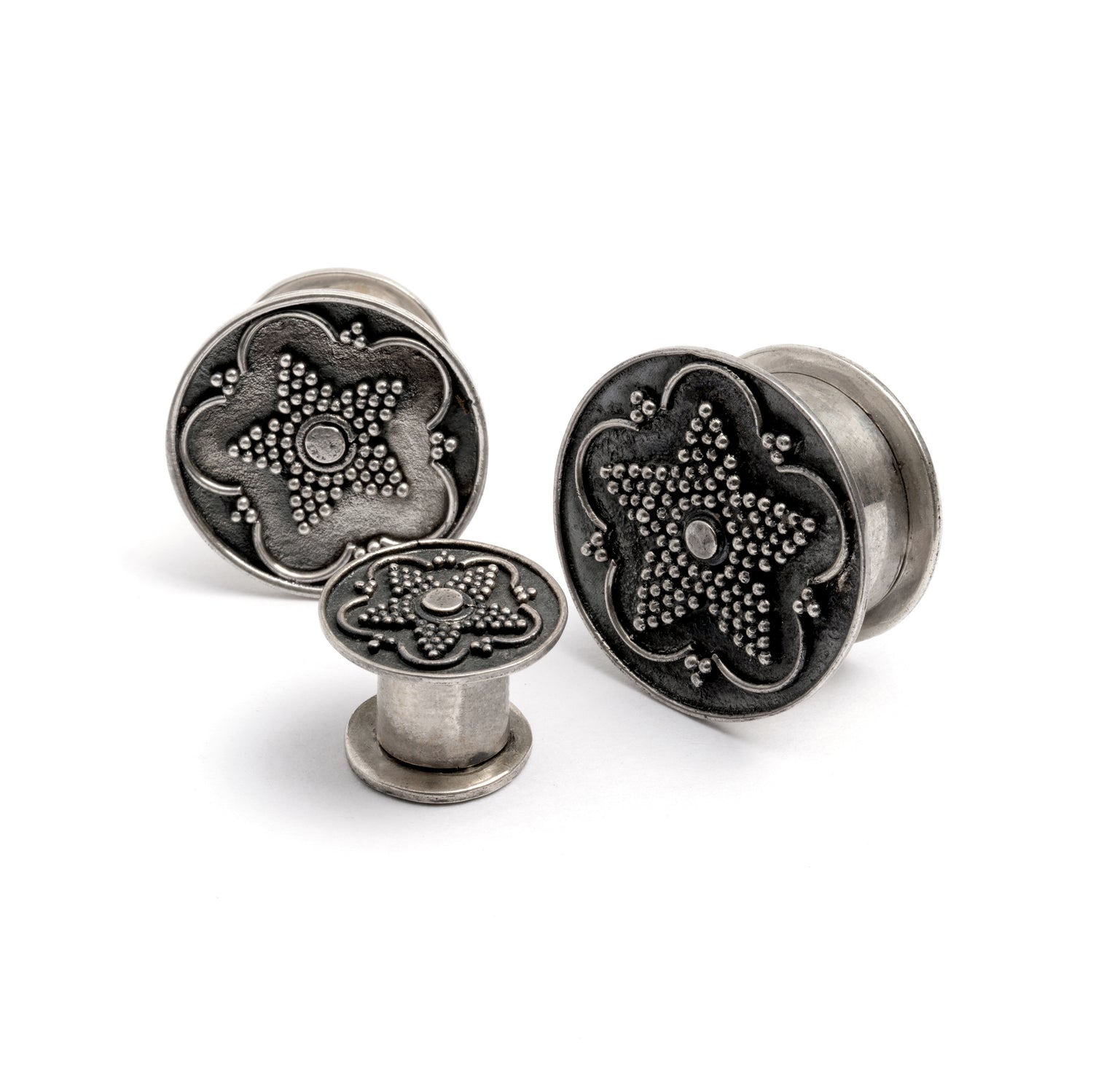 different sizes of Antique Silver Plug Tunnel with star ornament and a screw on closure