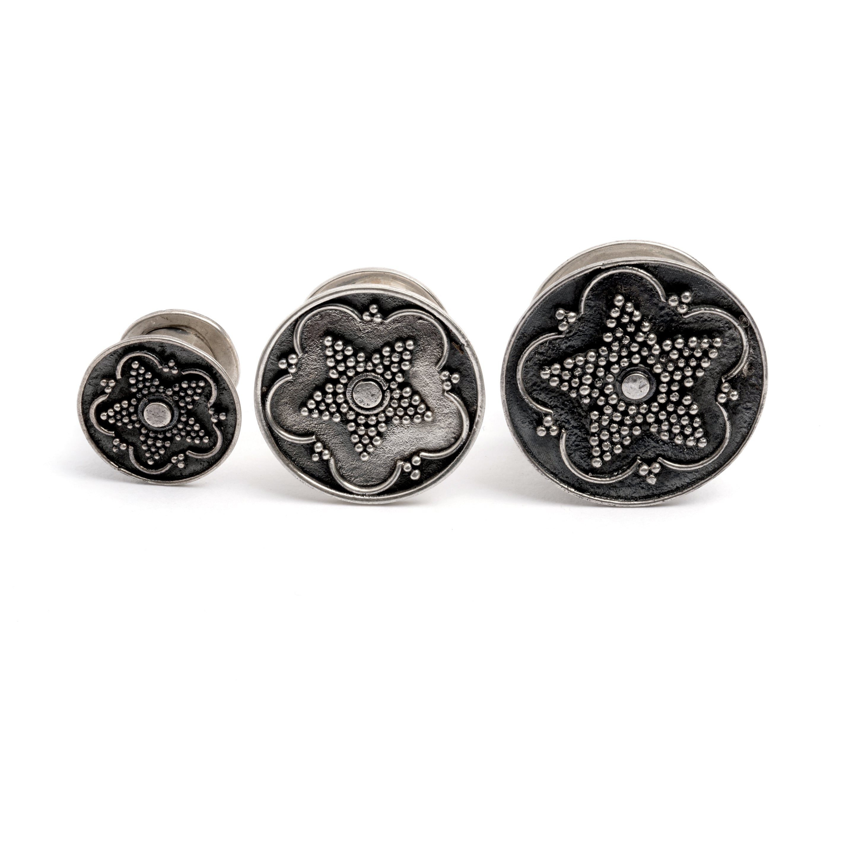 different sizes of Antique Silver Plug Tunnel with star ornament and a screw on closure frontal view