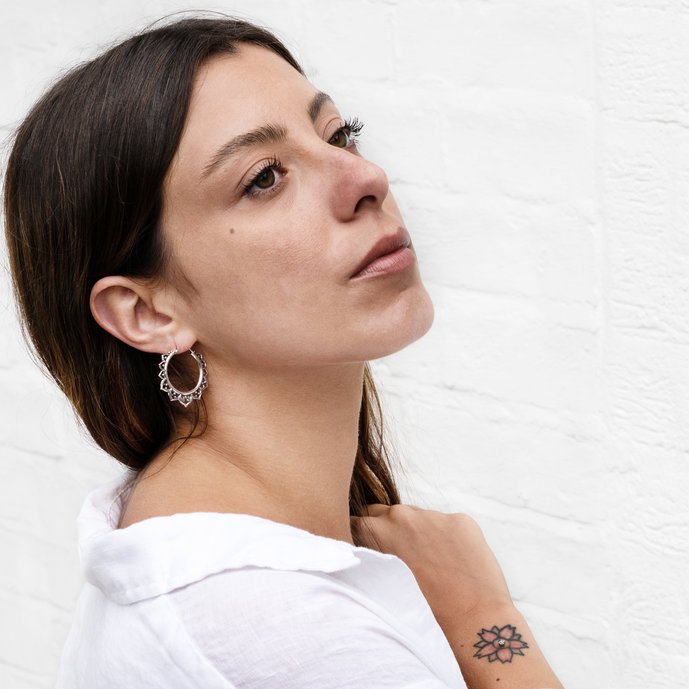 model wearing Aqua Lotus Silver Hoop earrings