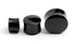 several sizes of black agate ear plugs