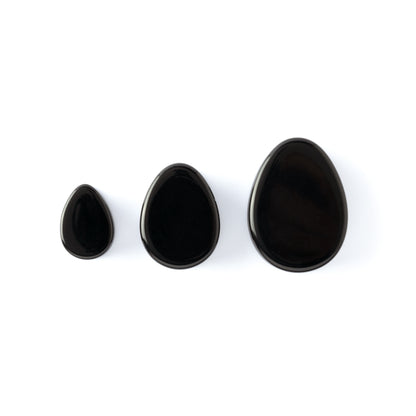 three sizes black Agate teardrop plugs with double flared ends frontal view