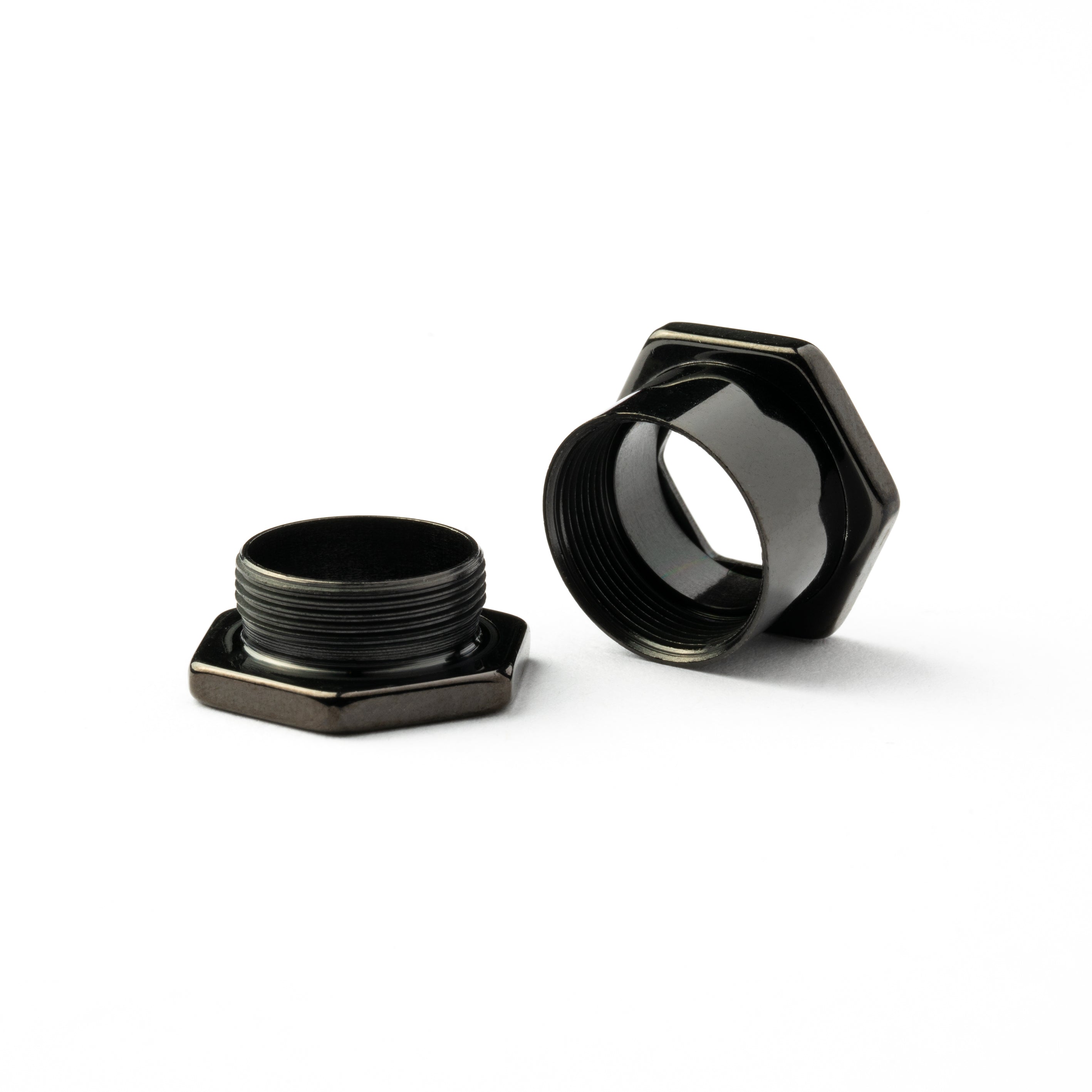 single surgical steel black hexagon ear tunnel front screw back closure view