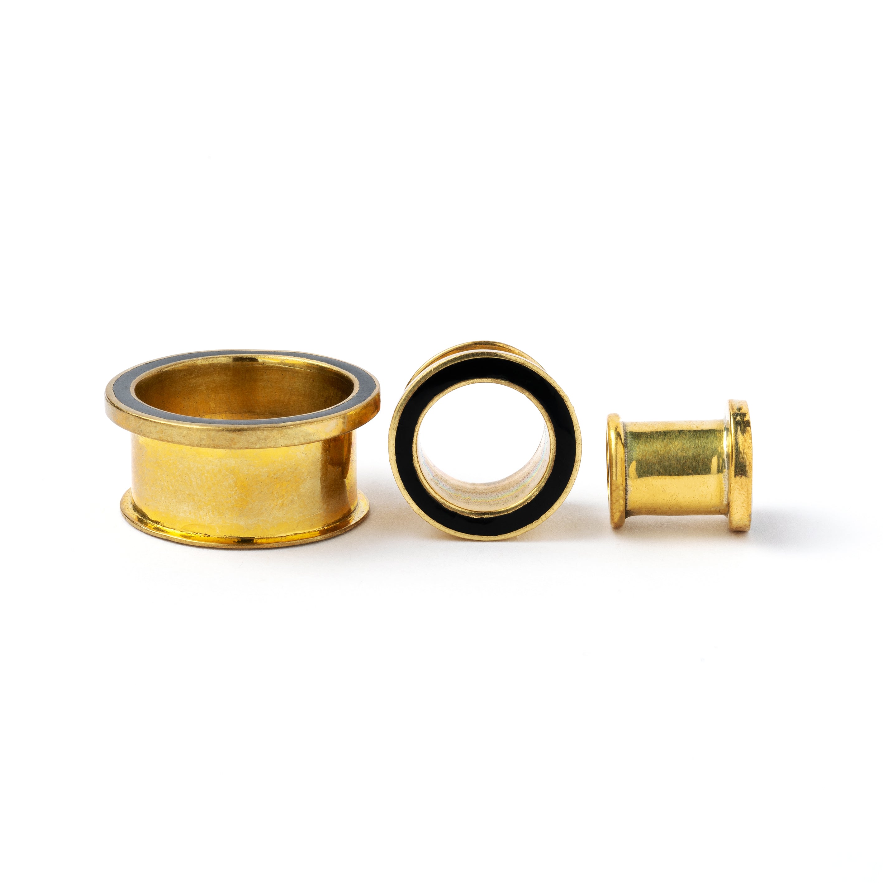 different sizes of Golden brass plug tunnel with black resin inlay