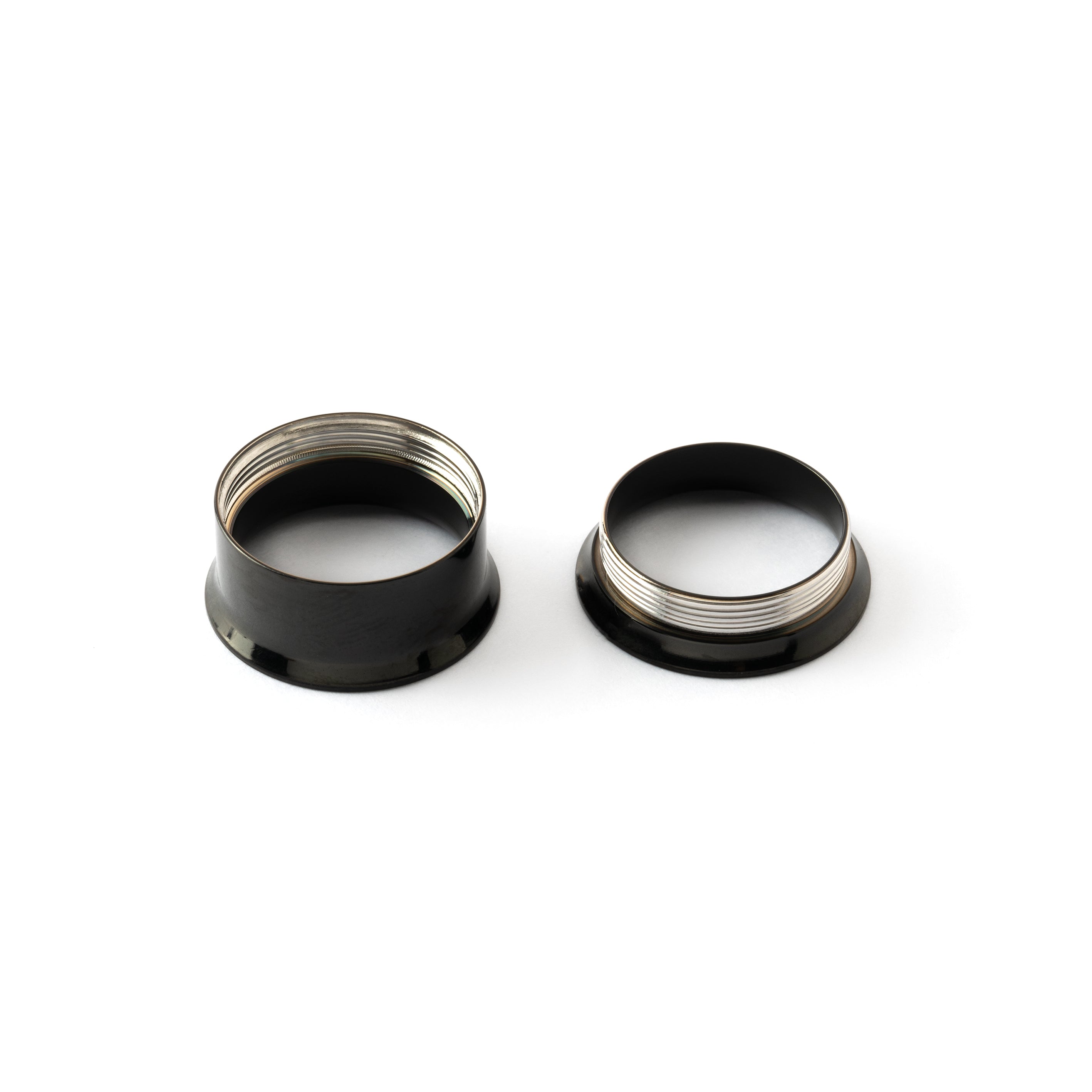 screw back closure of shiny black surgical steel plug tunnel