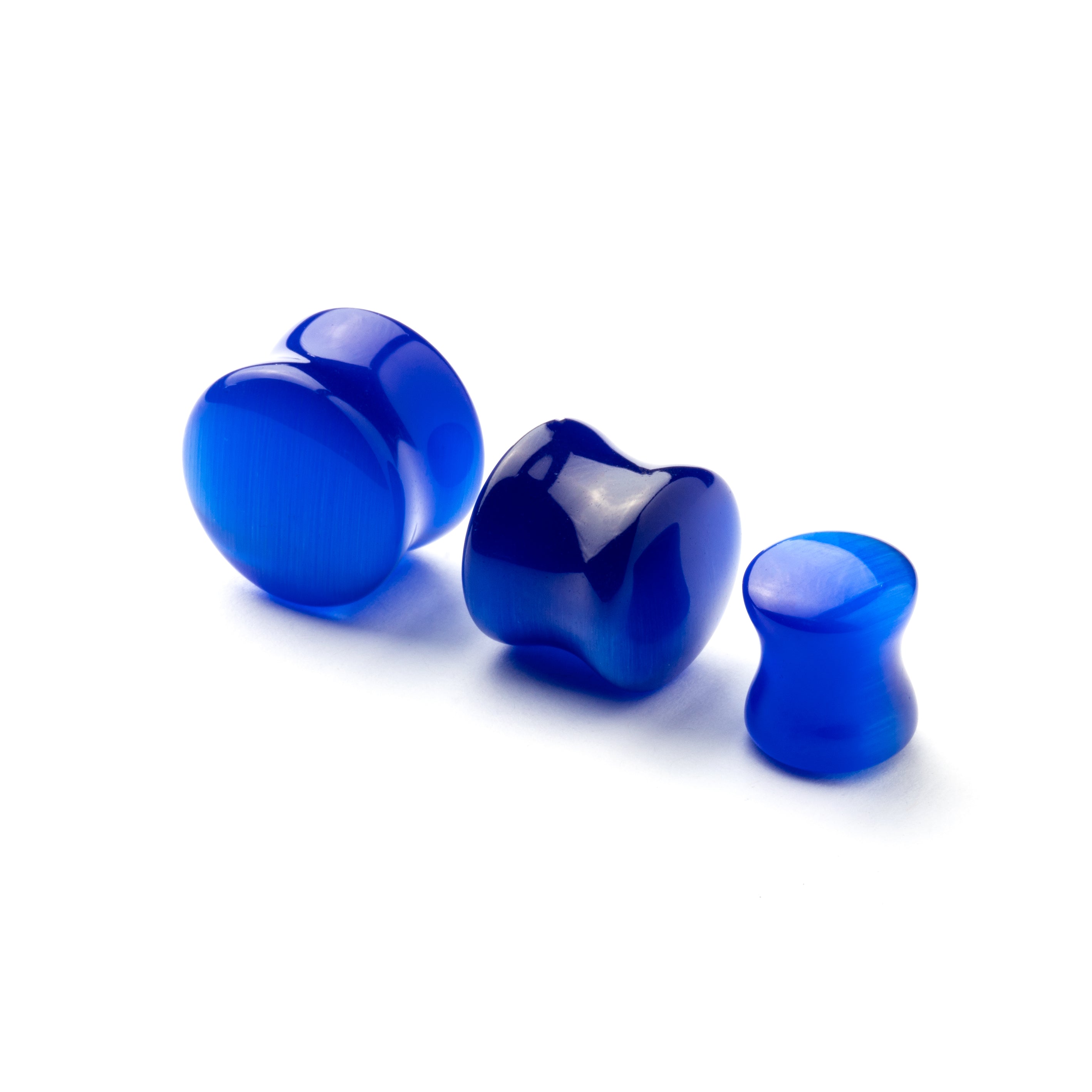 several sizes of double flared Blue Cat Eye stone ear plug side and front view