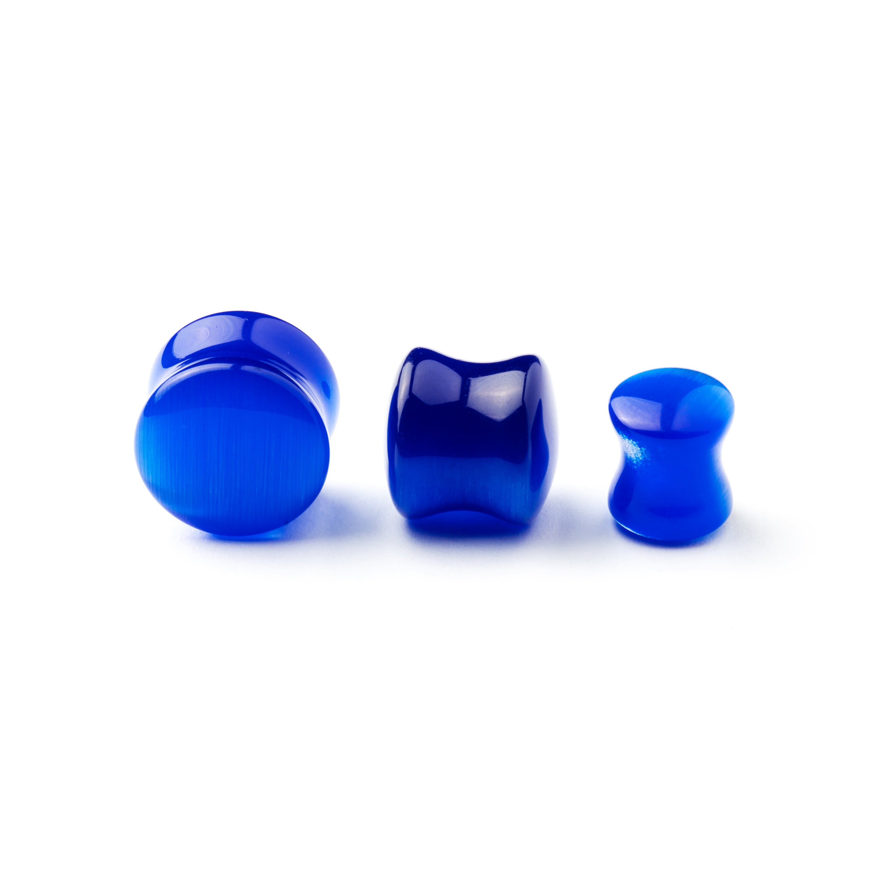 several sizes of double flared Blue Cat Eye stone ear plug front view