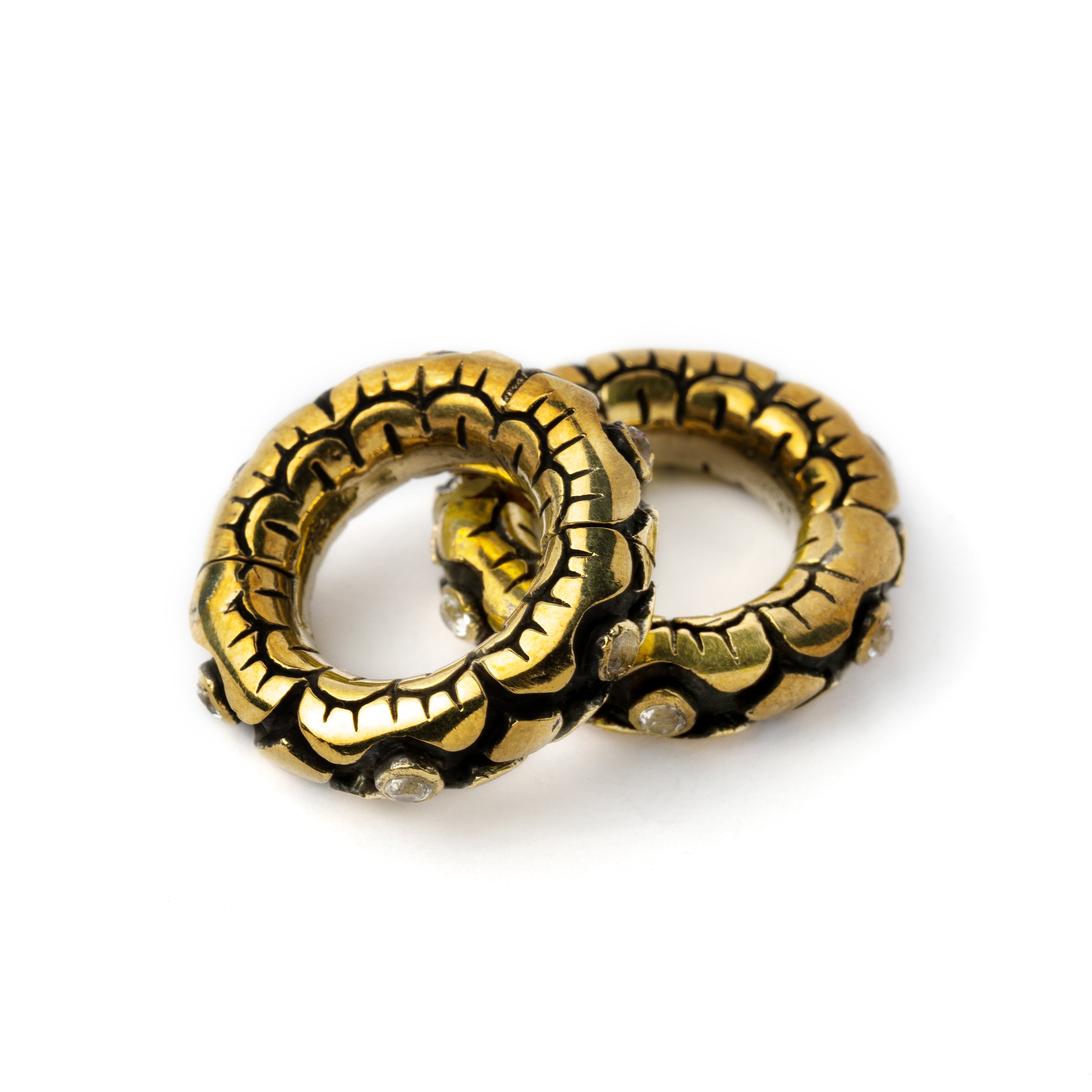 pair of golden flower clicker hoops hangers for stretched ears with topaz stones