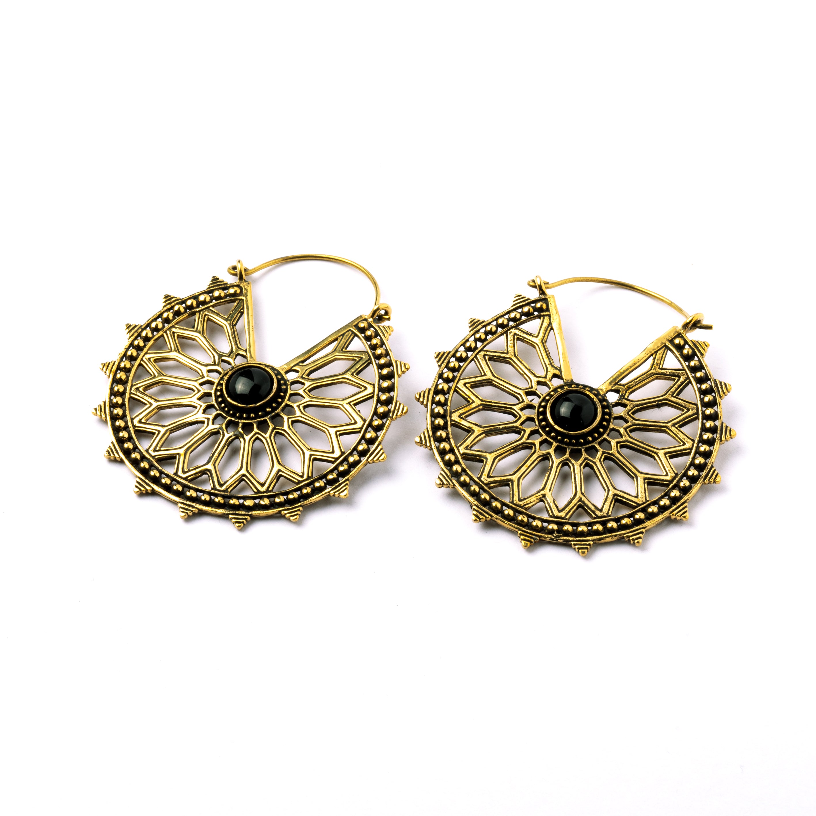 pair of golden brass geometric flower earrings with black onyx right side view
