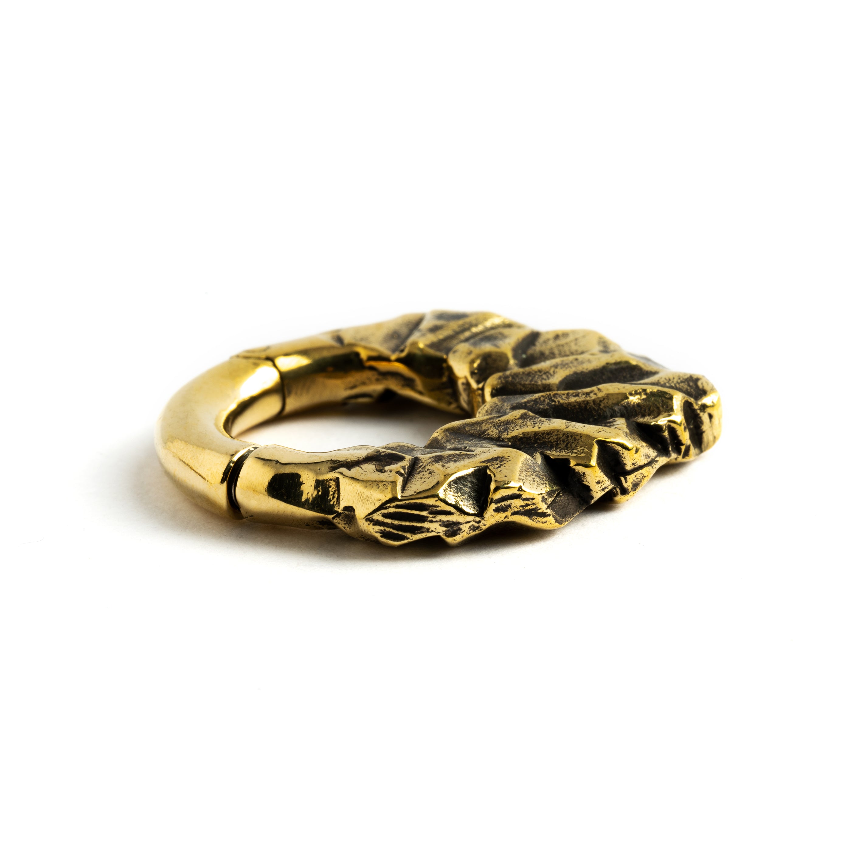 single gold brass teardrop shaped ear hoop hanger with rocky texture close up side view
