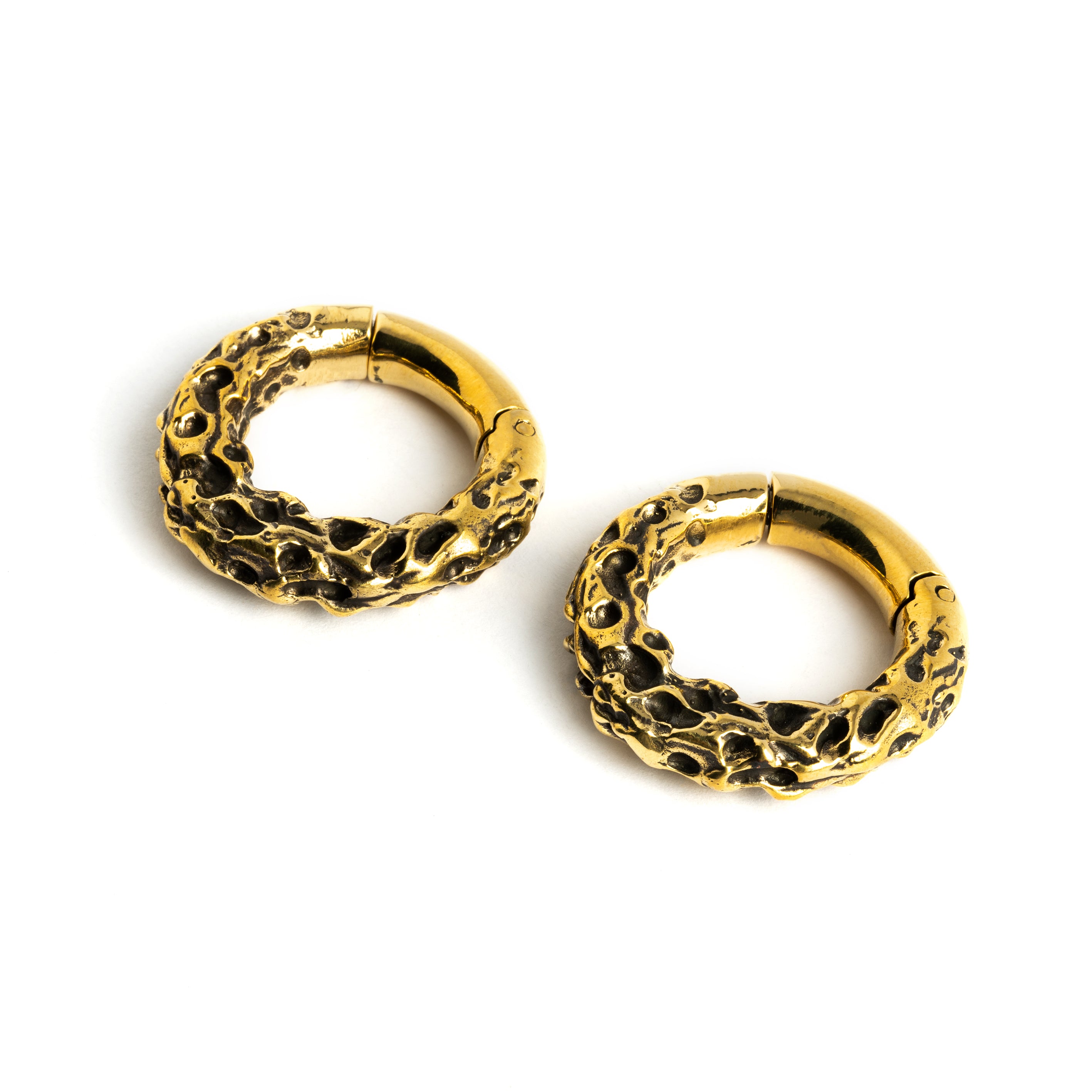Pair of gold brass hoop hangers with rocky texture right frontal view