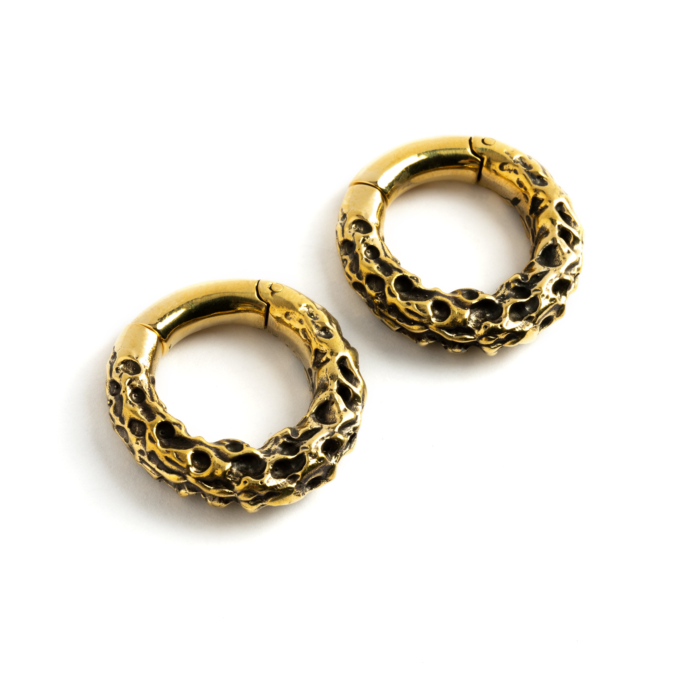 Pair of gold brass hoop hangers with rocky texture left front view