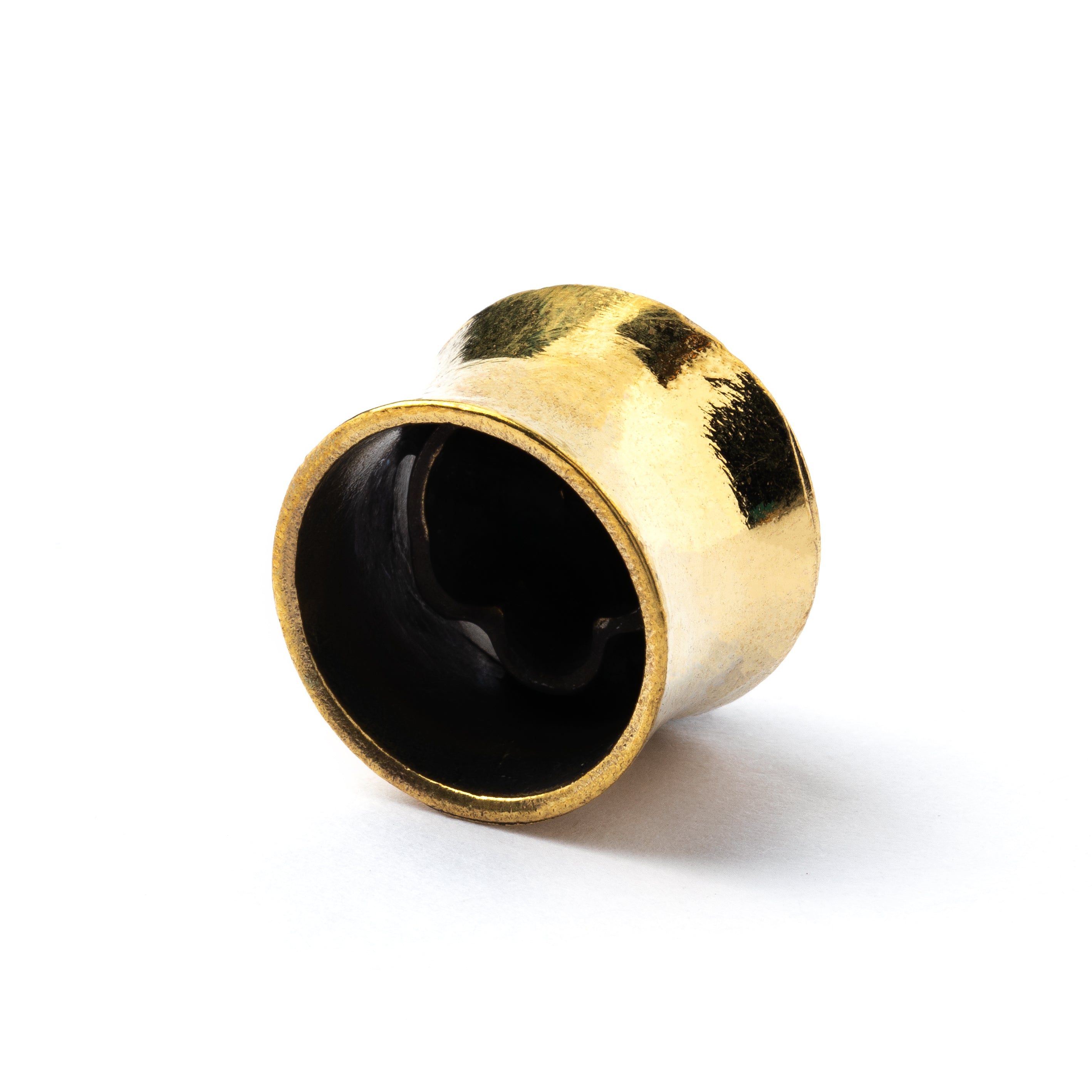 Brass skull ear plug back side view