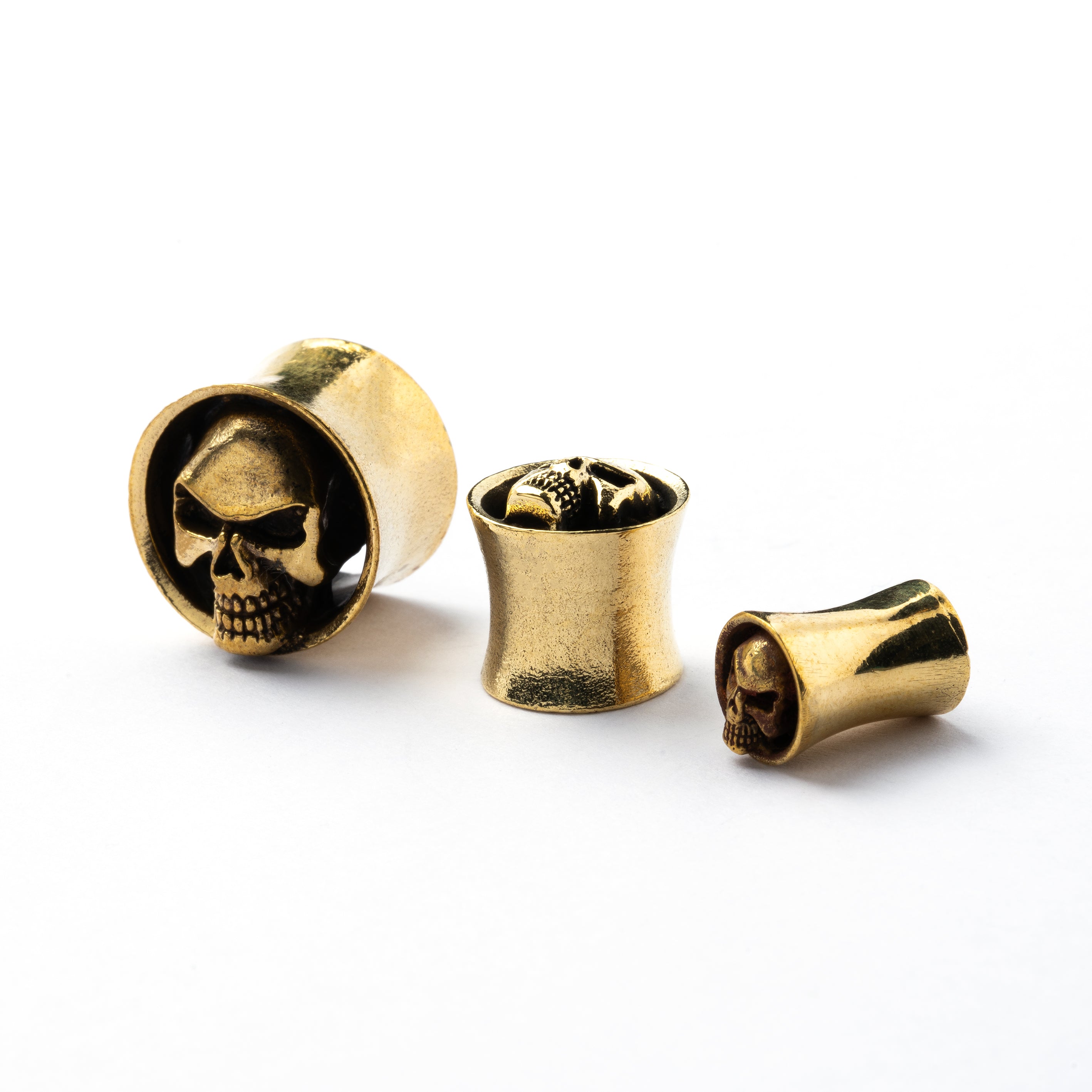 Brass skull ear plugs front and side view