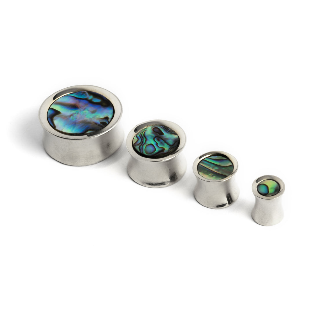 several sizes of silver ear plugs with abalone inlay front view